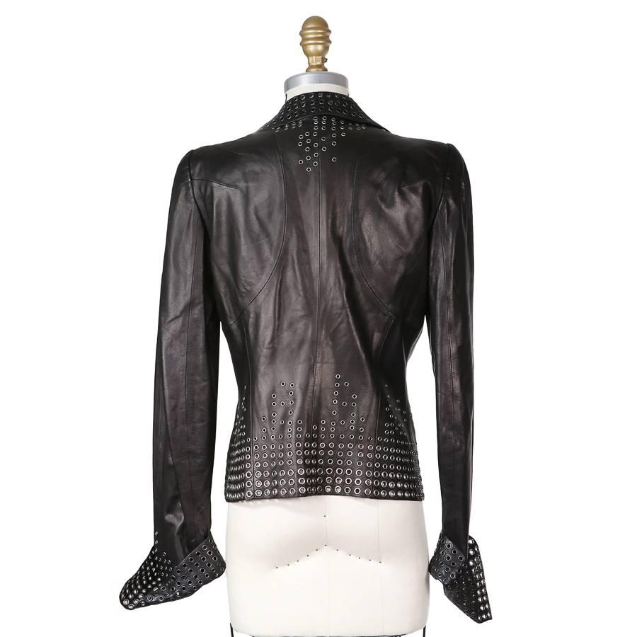 This is a leather jacket from Alexander McQueen featuring a grommeted design and has a front zipper closure.  

15
