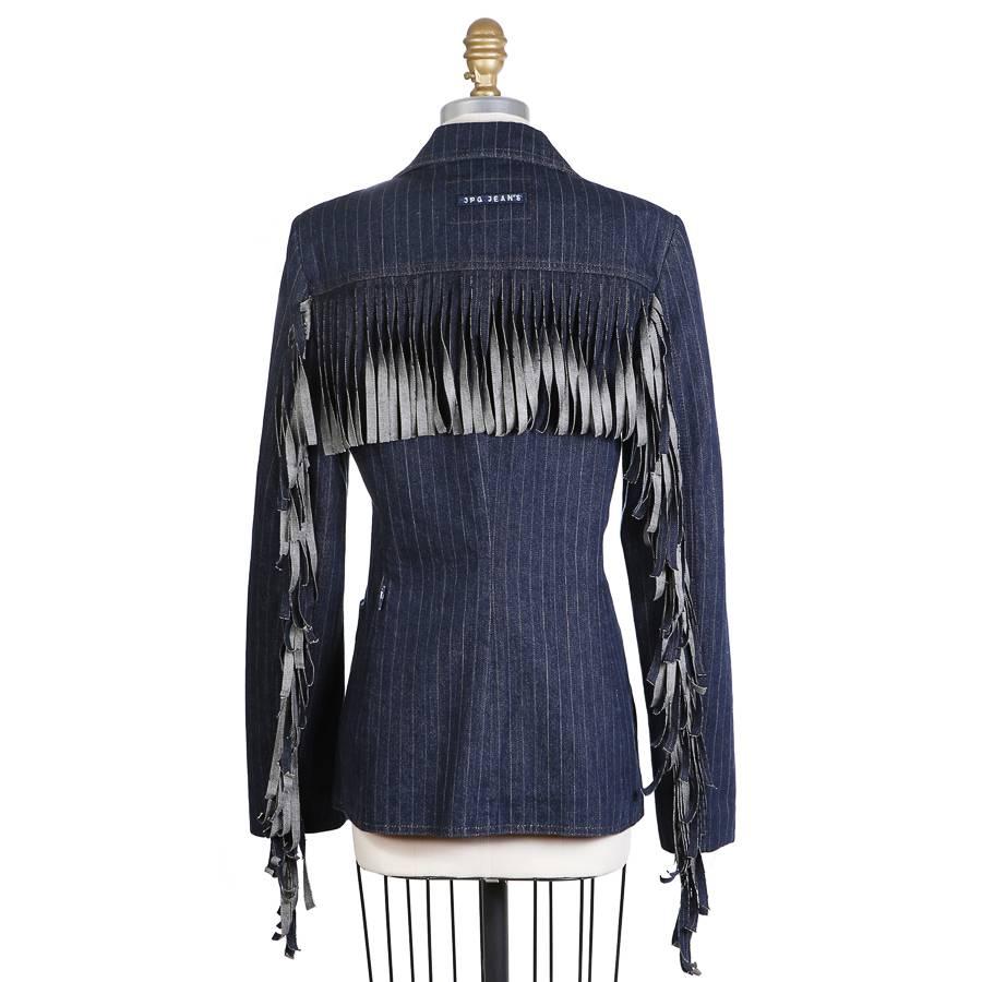 Dark blue denim pin stripe blazer by Jean Paul Gaultier for JPG Jeans.  It features fringe cut denim across back and down arms, single breast front closure, and two front waist pockets as well as a breast pocket.  Lined in navy woven cotton.

16