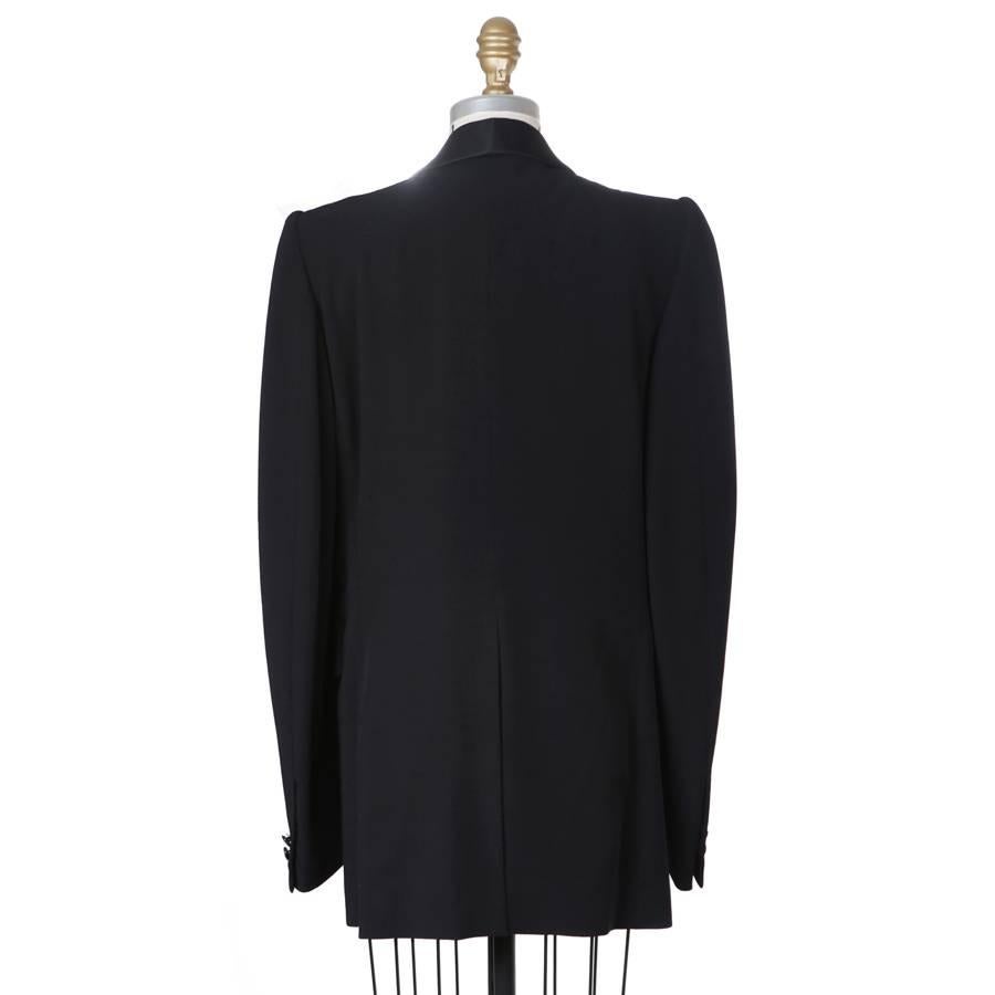 This is a tuxedo style blazer from Maison Margiela.  It features a rounded satin lapel and a single breast closure.  Lana wool outer, cotton lined.

16