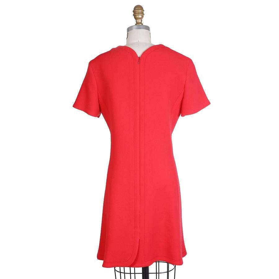This is a wool dress by Raf Simons for Christian Dior.  It has an A-line cut and features a graphic line creased into the front.  100% virgin wool outer, silk lined.

16