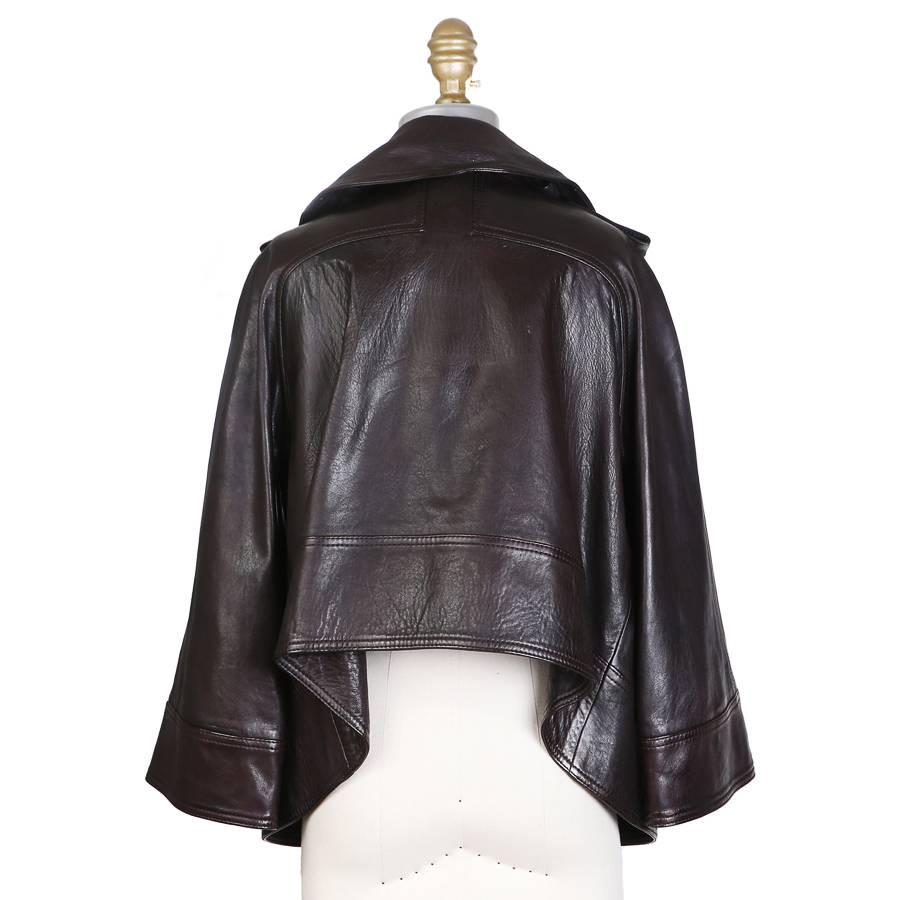 This is a brown leather jacket from Proenza Schouler.  It features an A-line draped fit and a 3/4 sleeve.