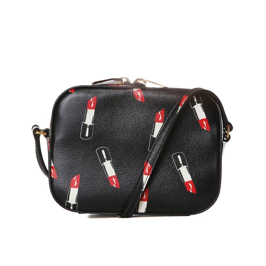 This is a leather mini shoulder bag from Yves Saint Laurent that features a lipstick print.  Adjustable shoulder strap that has a drop of 25