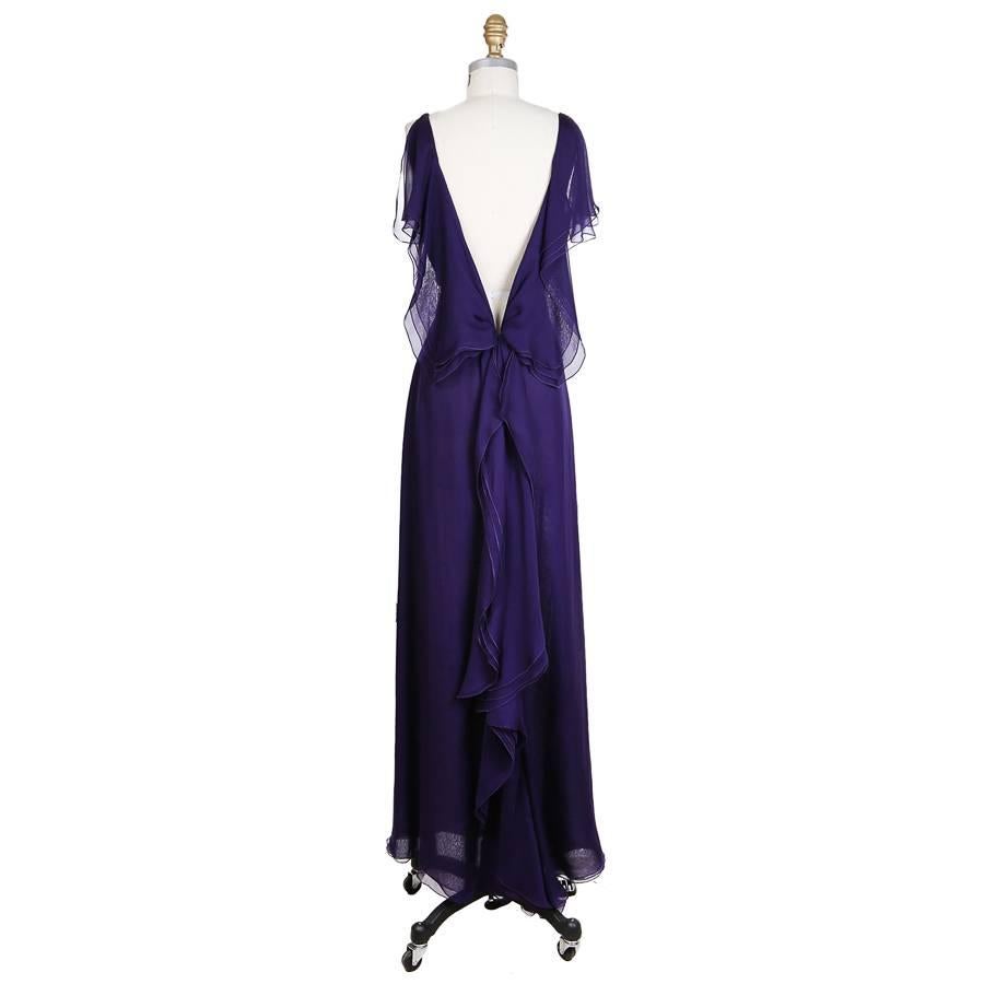 This is a sleeveless gown by Valentino for the Hiver 2008 collection.  It features a plunging V back and higher neckline in front.  Delicate purple silk organza.