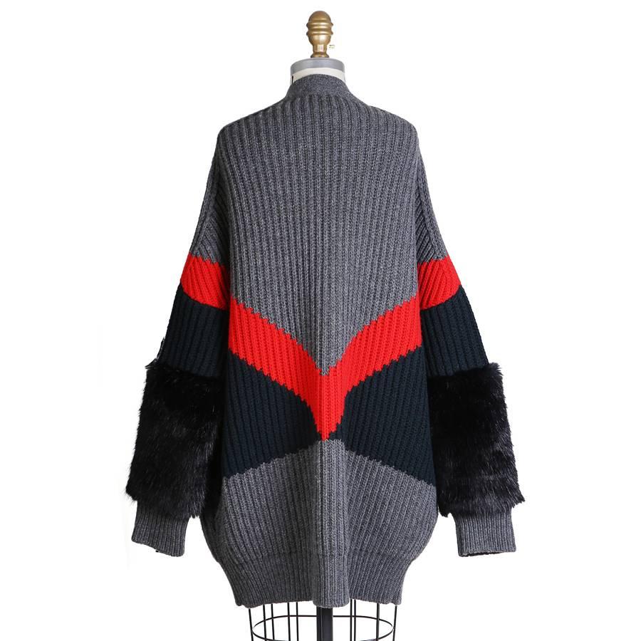 This is a knit wool cardigan from Stella McCartney.  It features faux fur cuffs and has an oversized fit.