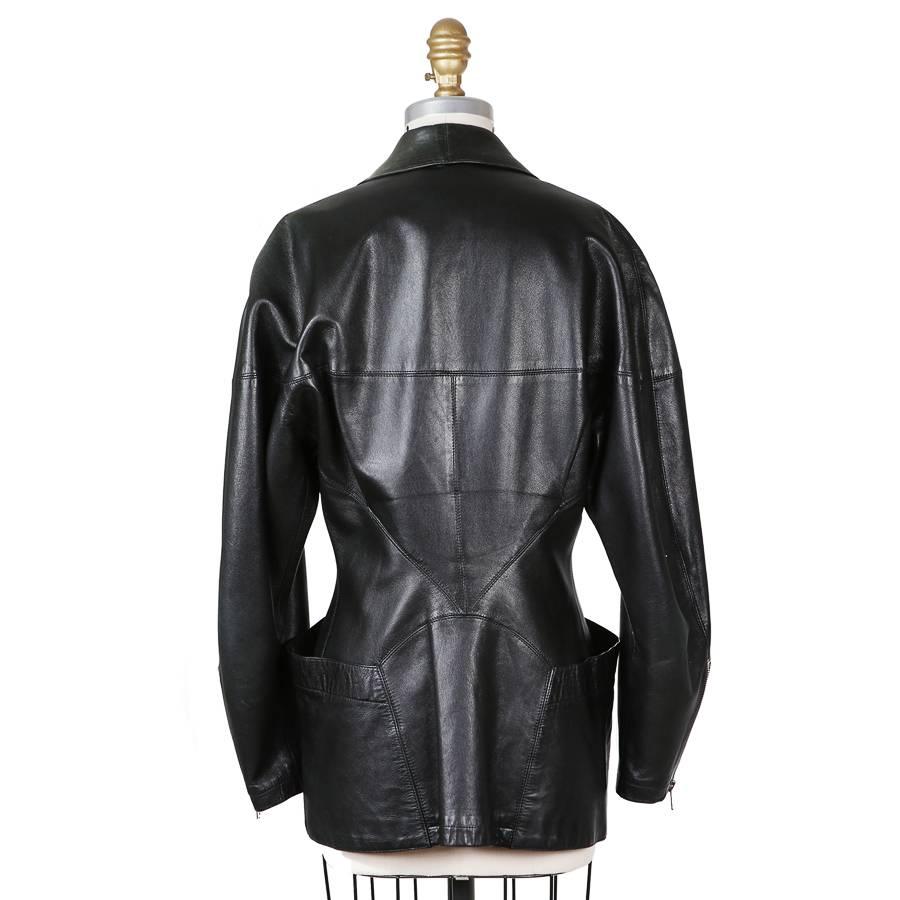 This is a leather jacket by Azzedine Alaia circa 1990s.  It features curved style lines, hip pockets from front to back, and a raglan sleeve.  Rounded lapel with a single button closure.