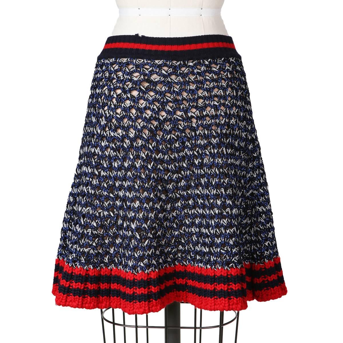 Recent skirt from Gucci.  Features an ivy league / varsity motif knit with metallic threads to catch the light.  Flared cut and has a nude silk lining.  

Size XS
23