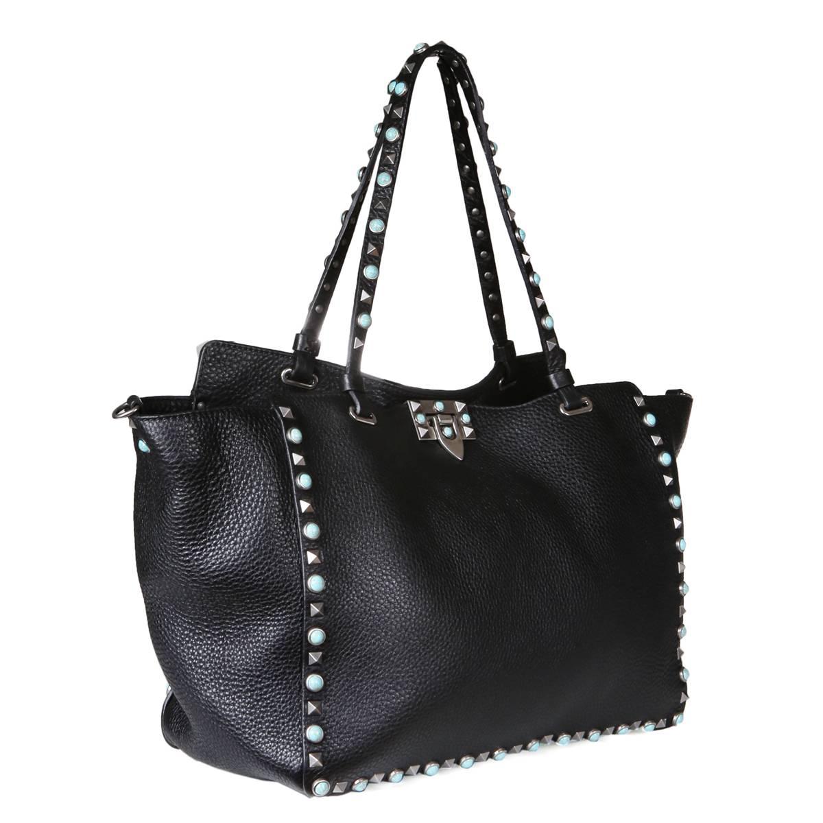 Tote from Valentino.  Includes single shoulder strap.  Black leather with pyramid stud and turquoise trim.  

Dimensions:  12.5