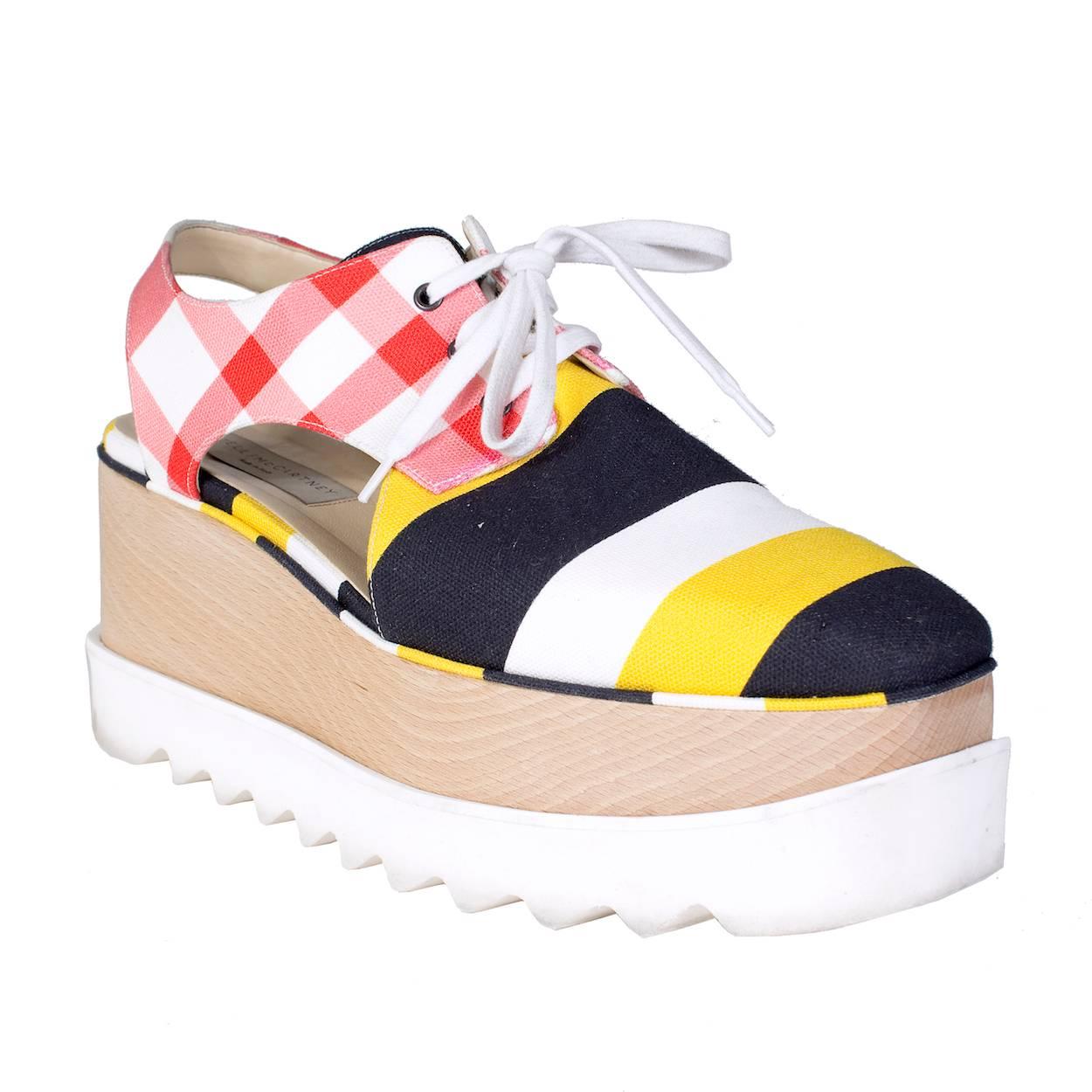 Sneakers by Stella McCartney.  Multi pattern canvas design with cutouts and rubber ridged soles. 

Size 40
2