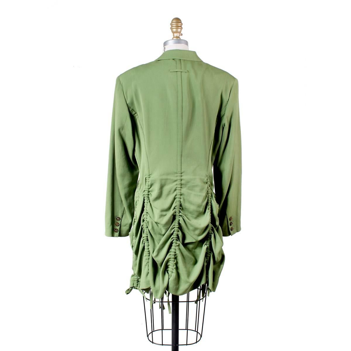Coat by Jean Paul Gaultier circa 2000s.  Features vertical drawstrings that can be cinched to create a scalloped tiered hem.  Cotton/rayon/wool blend.

Size 42
16.5