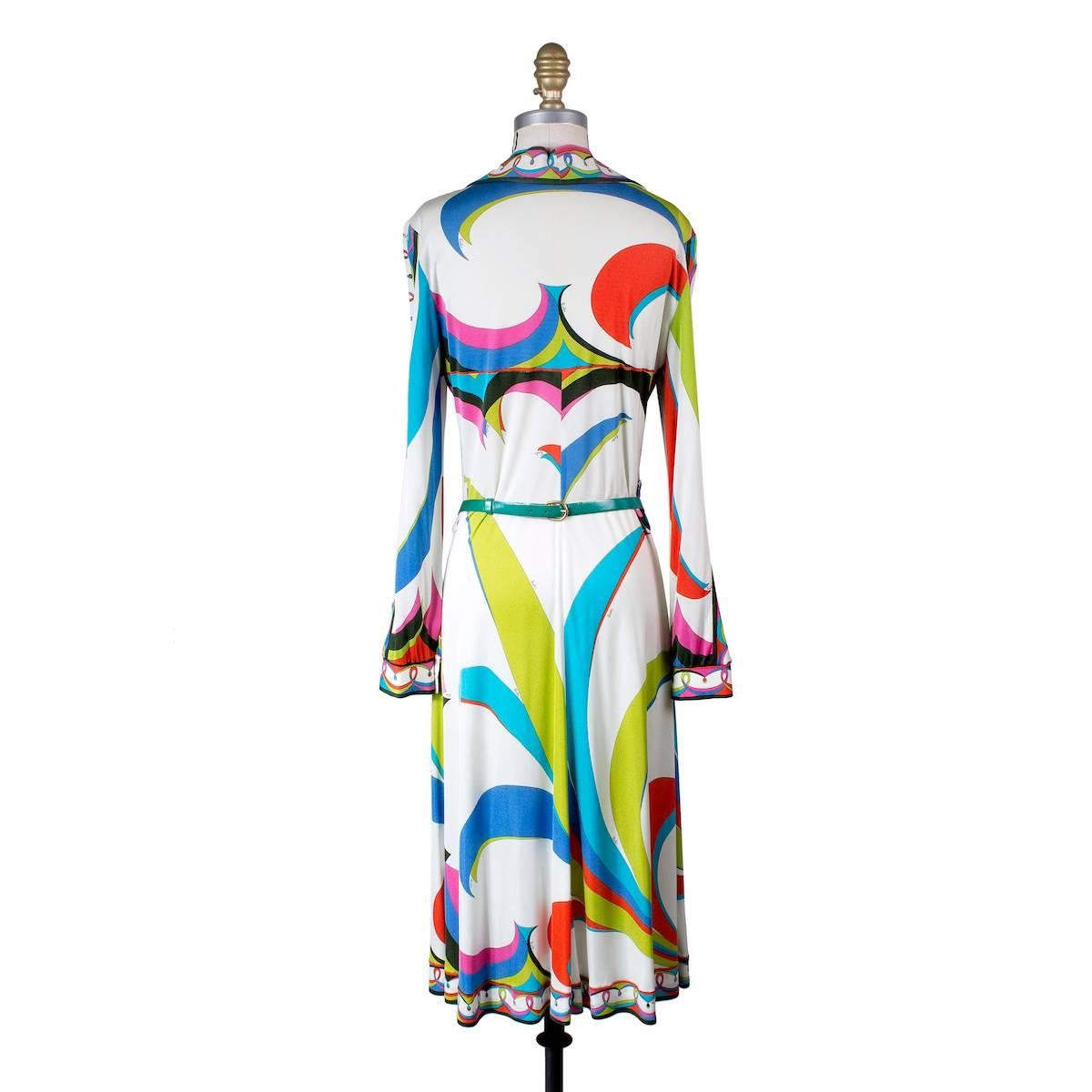 This is a vintage Pucci dress circa 1970s.  It features a signature Pucci print and includes a matching belt to cinch the waist.