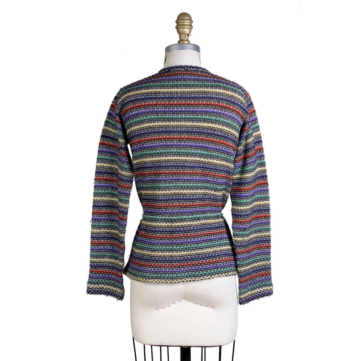 Vintage cardigan sweater from Missoni circa 1970s/1980s.  It features a cinch tie in the waist and button closure down the front.  60% wool 40% cotton.