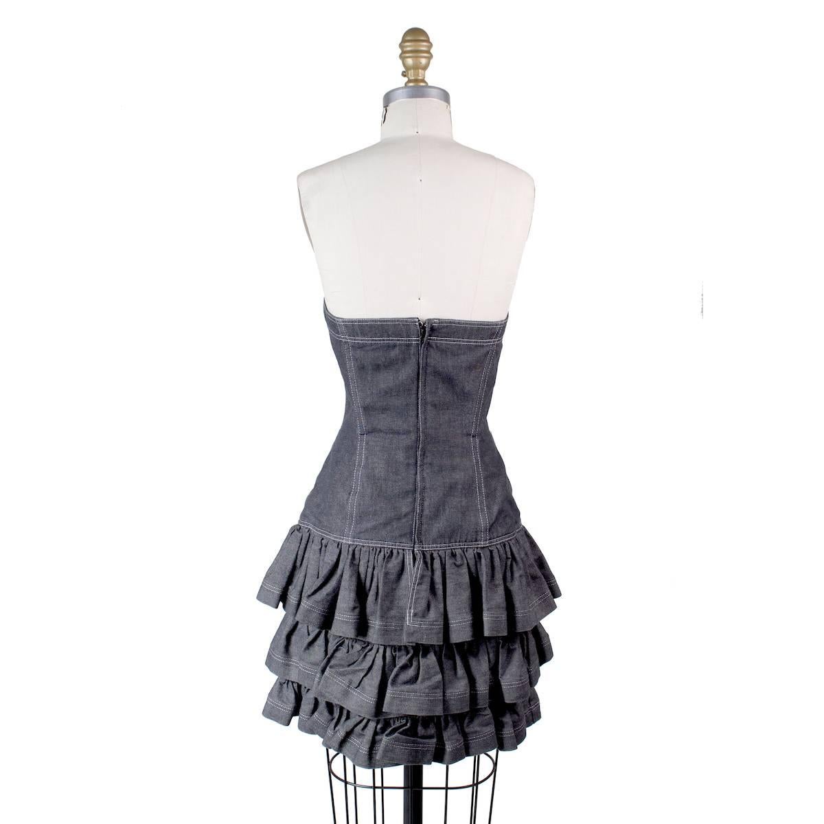 This is a strapless dress by Patrick Kelly.  It features a sweetheart bust and ruffled skirt.  