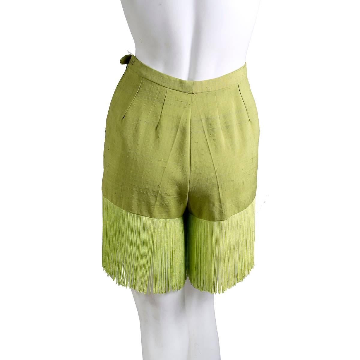 Pair of heavy linen shorts from Pucci.  It features a side zipper closure and fringe along the hem.  High waisted fit with an 11
