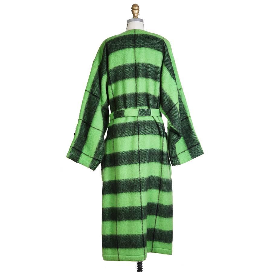 Vintage coat by Jean-Charles de Castelbajac.  Green and black plaid with thicker horizontal stripes.  Oversized fit with belt.  80% wool 20% polyester.  

23