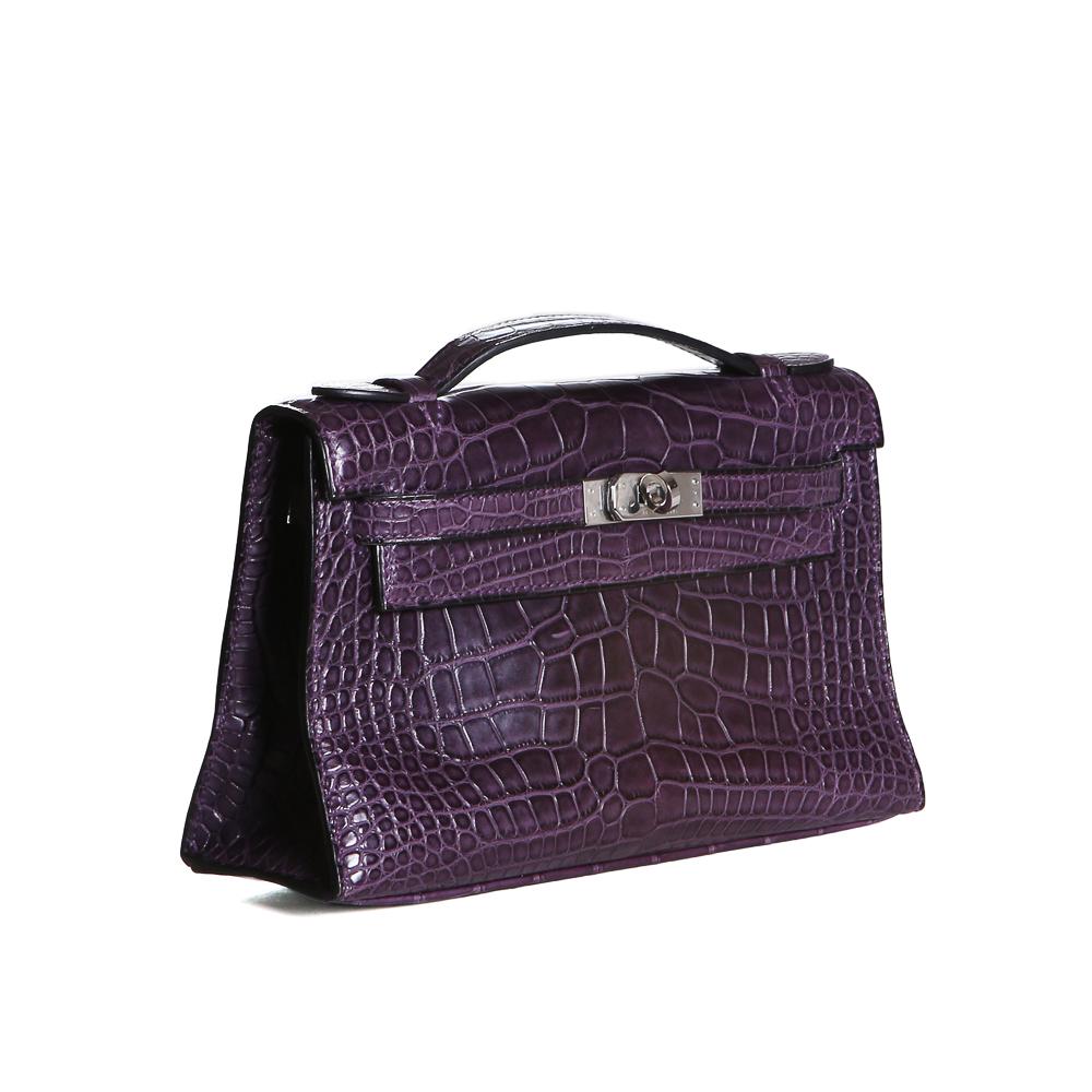 Product Details:
Mini Kelly bag by Hermes from 2008
Purple croc skin with silver palladium hardware
Kelly style with top handle
Dimensions:  8.5