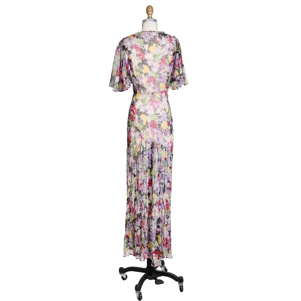 Vintage 1940s dress by unknown designer
Draped neckline
Butterfly sleeves
Sheer floral chiffon fabric 
Includes separate nude slip for underneath
No closures
Condition: Excellent vintage condition
Size/Measurements:
Approximate size small
34
