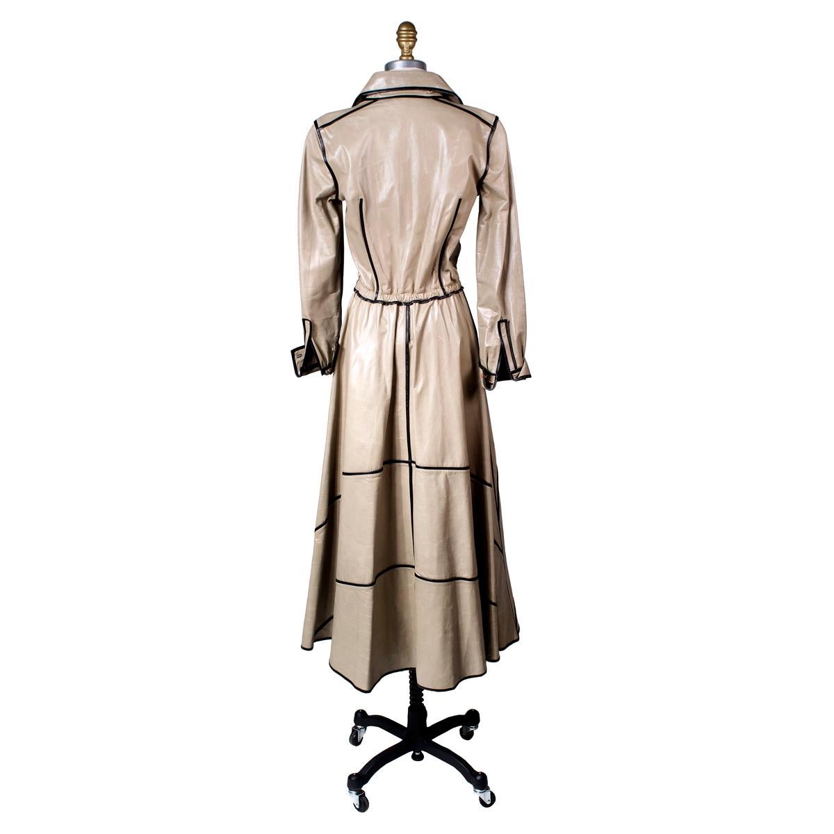 Vintage dress by Fendi circa 1970s
Taupe leather with black leather piping
Trenchcoat style dress with button closures from wait to neckline
Condition: Excellent, minor wear to leather
Size/Measurements:
Italian size 40
15.5