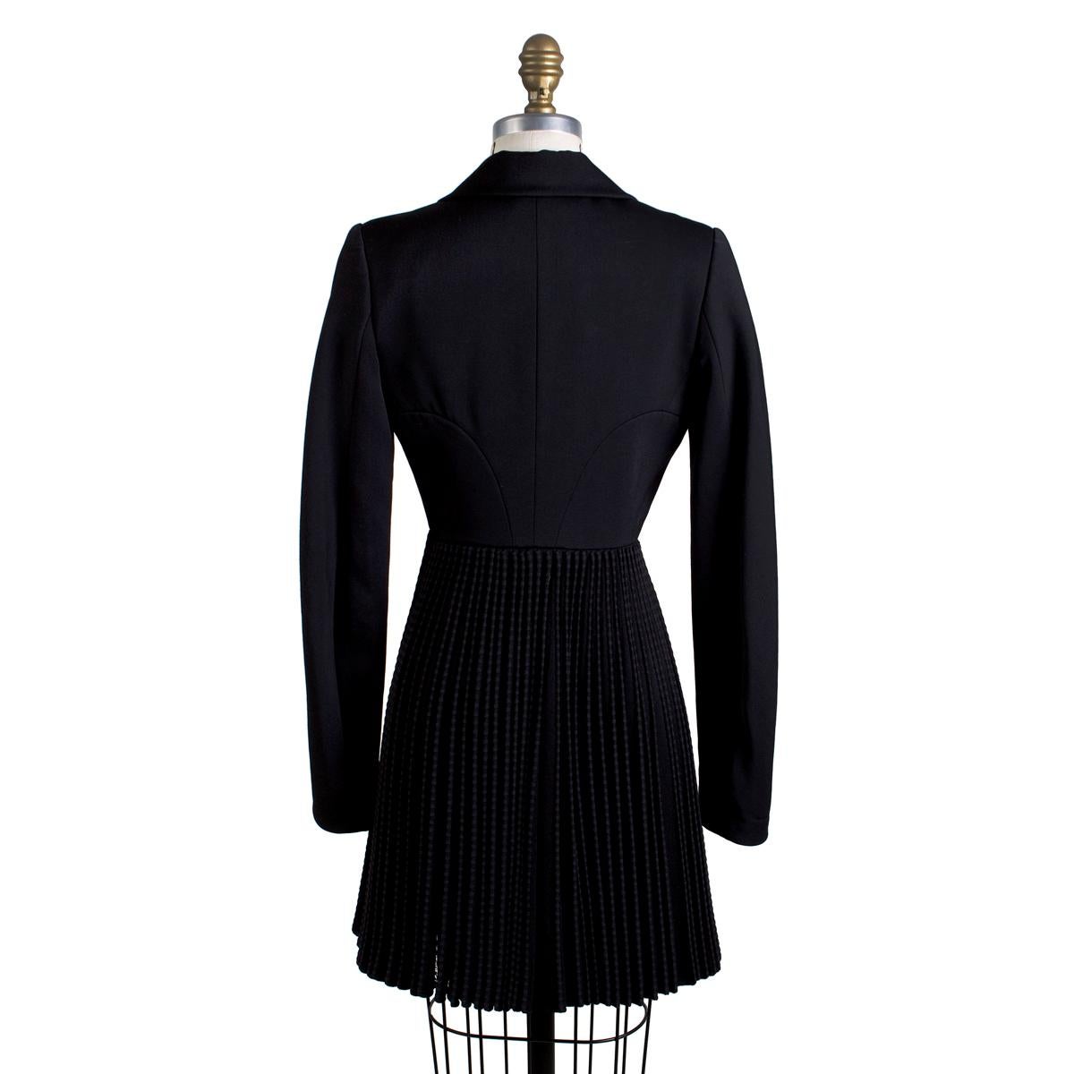 Coat by Azzedine Alaia
Accordion pleated skirt
Large lapel collar
Button closure in front
Black stretch wool knit fabric
Condition: Excellent
Size/Measurements:
Size 36
15