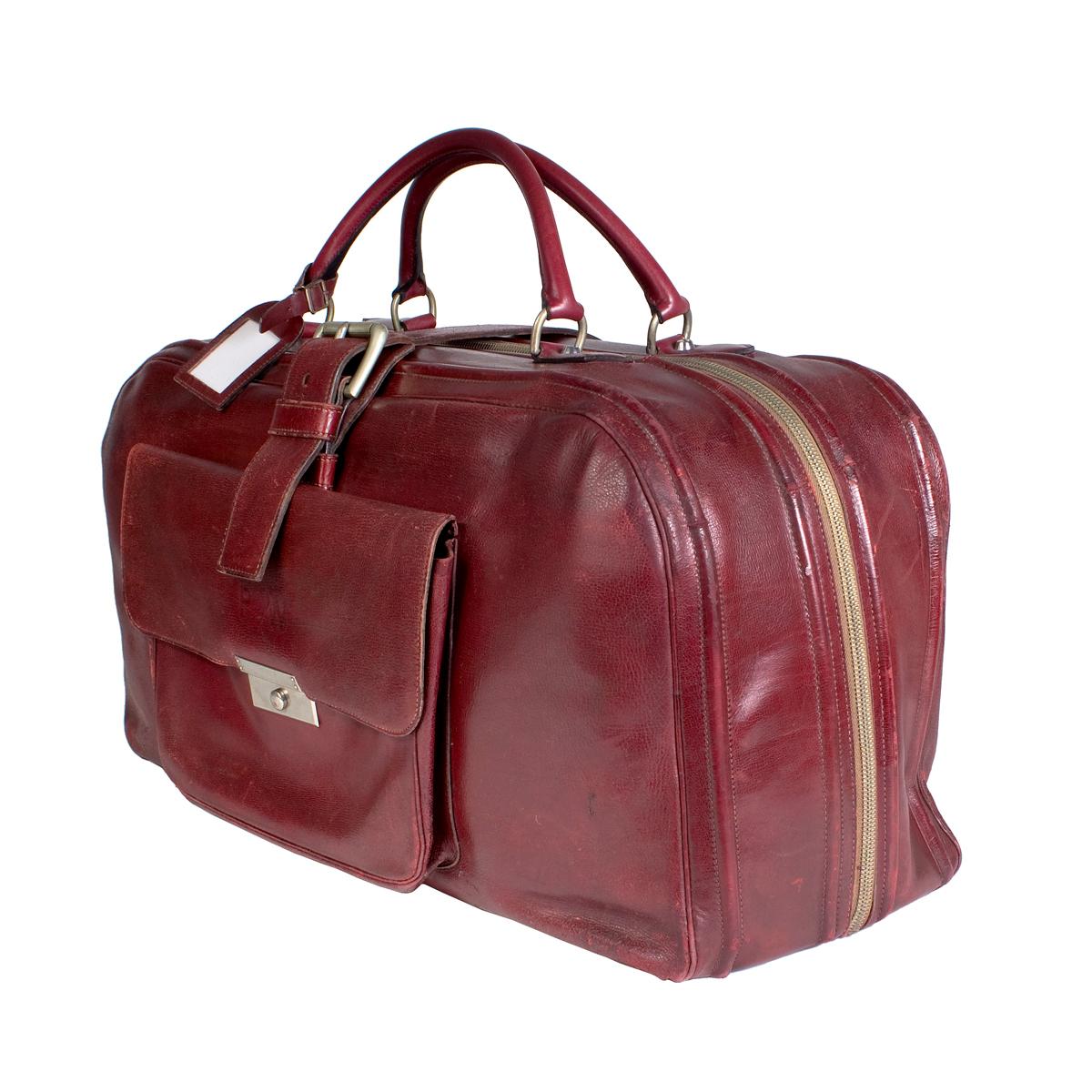 Travel duffle by Hermes
Zipper closure along top and side
Two top handles
Front pocket pouch 
Additional belt strap secure closure on top
Dimensions:  24