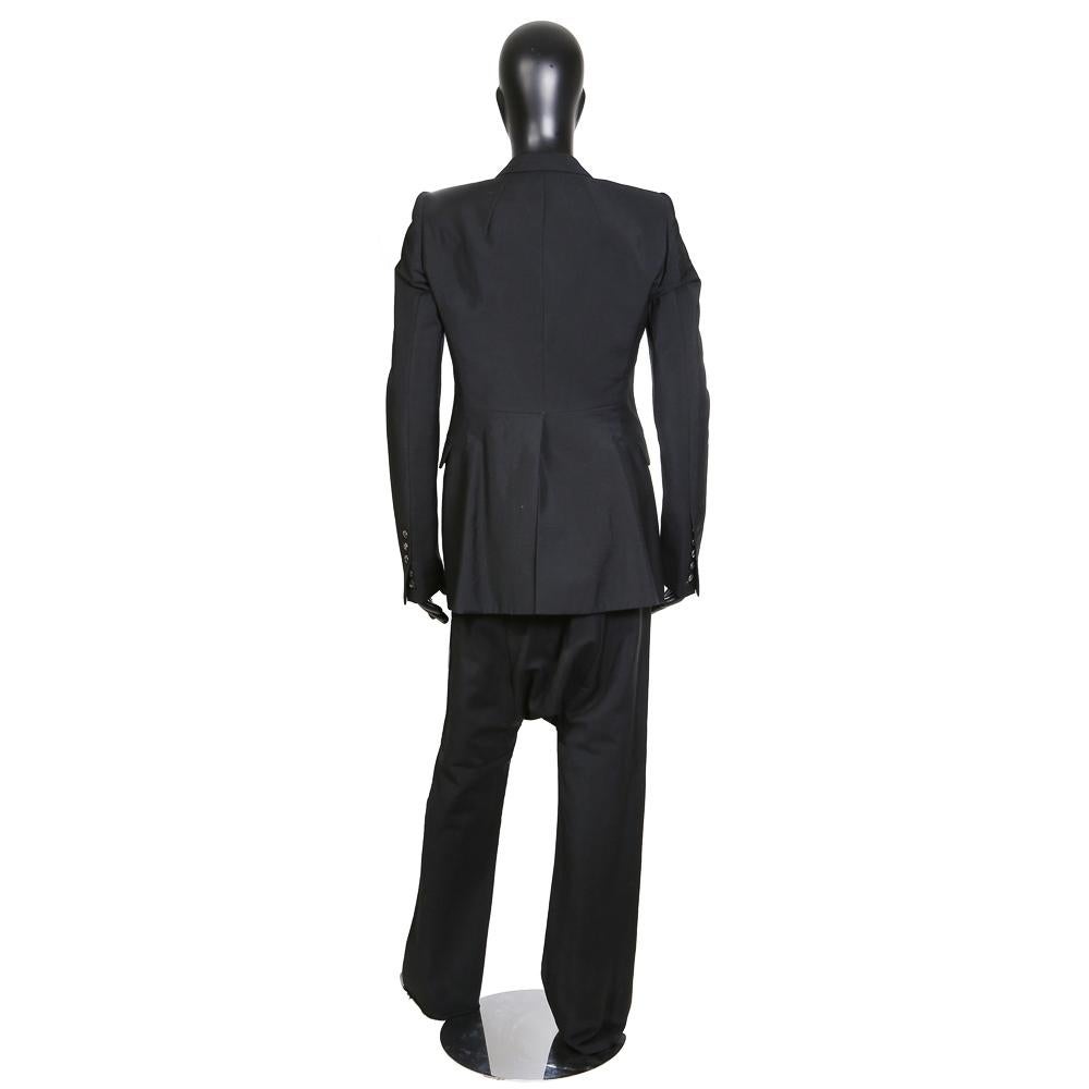 Men's suit by Rick Owens 
Drop crotch fit pants with a bootcut leg
Single breasted jacket
Two inside zipper chest pockets (Rick Owens signature)
Condition: Excellent

Size/Measurements:
Jacket size large
20.5