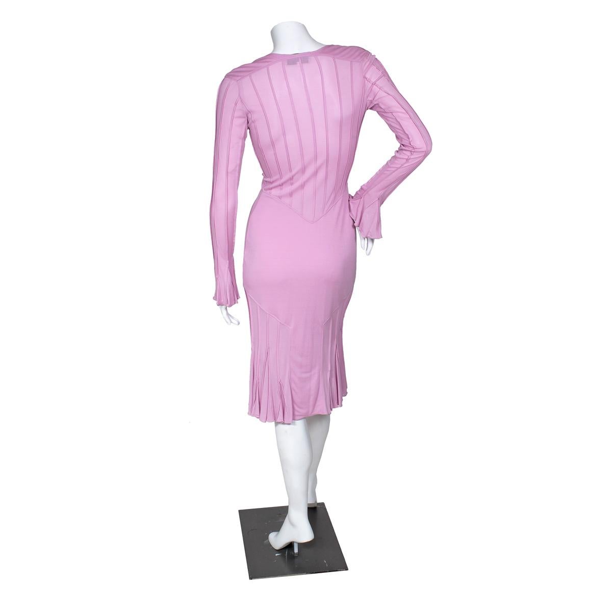Dress by Tom Ford for Yves Saint Laurent, early 2000s
Vertical body contouring seaming
Scoop neck
Stretch viscose material in a rose pink shade
Condition: Great, with minor wear to fabric

Size/Measurements:
Size medium
36