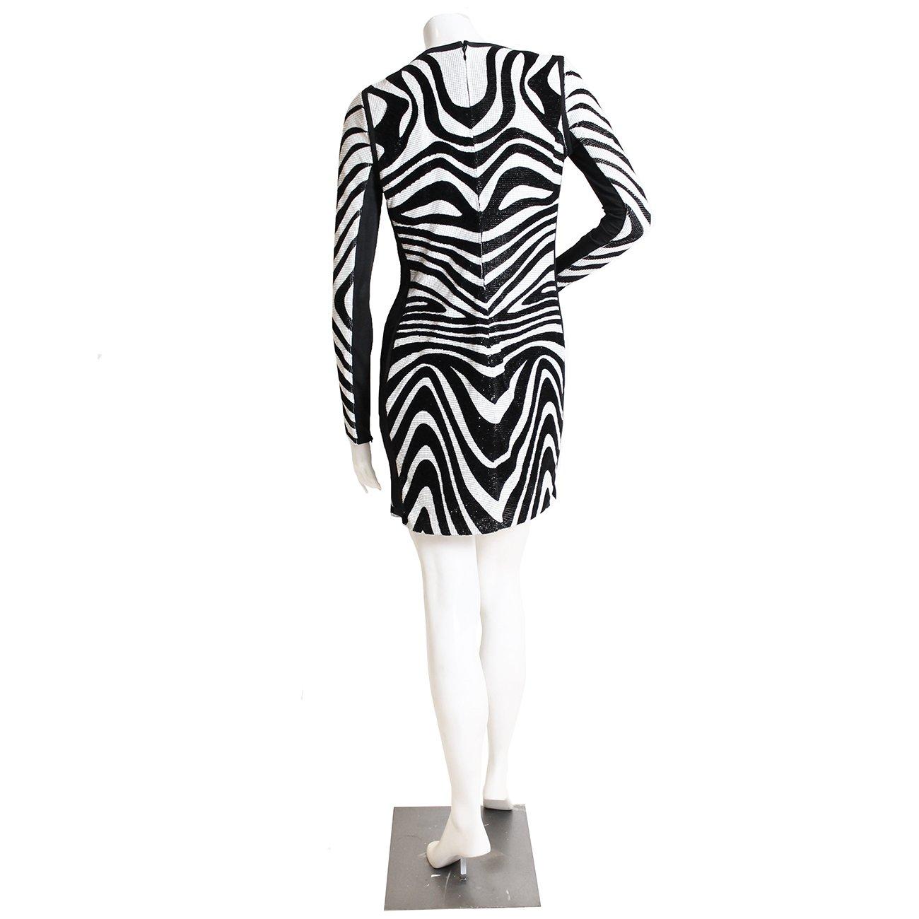 Exclusive Metal Mesh Swirl Dress by Tom Ford
Black and white velvet/metal mesh exterior 
Zipper closure at back and zippers on each cuff
Condition: Excellent, little to no wear 

Size/Measurements:
Size 38 
Sleeve: 25