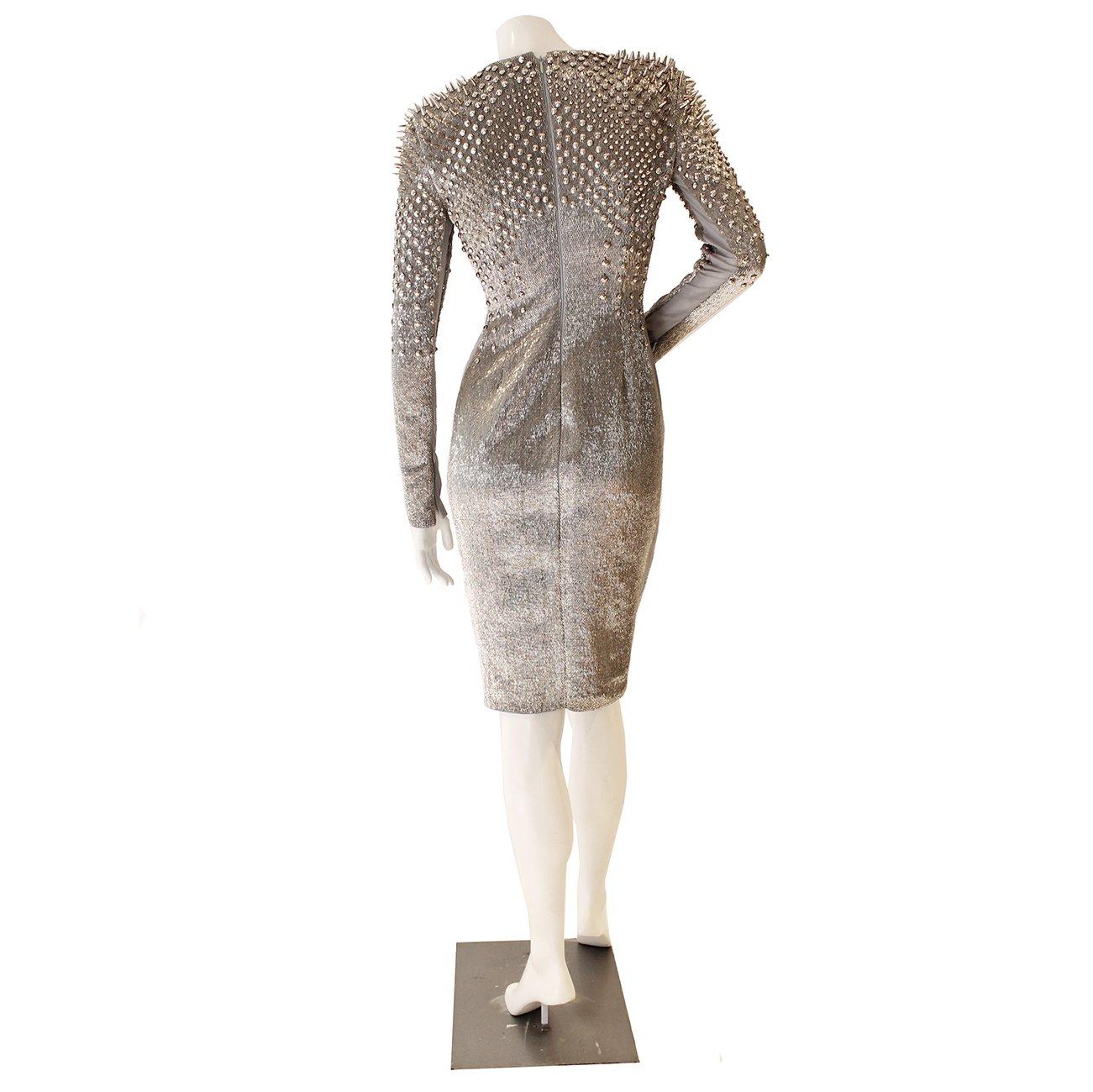 
Exclusive Silver Beaded Stud Dress by Tom Ford
Glass bead exterior with silver stud detailing
Zipper closure at back and zippers on each cuff
Condition: Excellent, new with tags 

Size/Measurements:
Size 38 
26