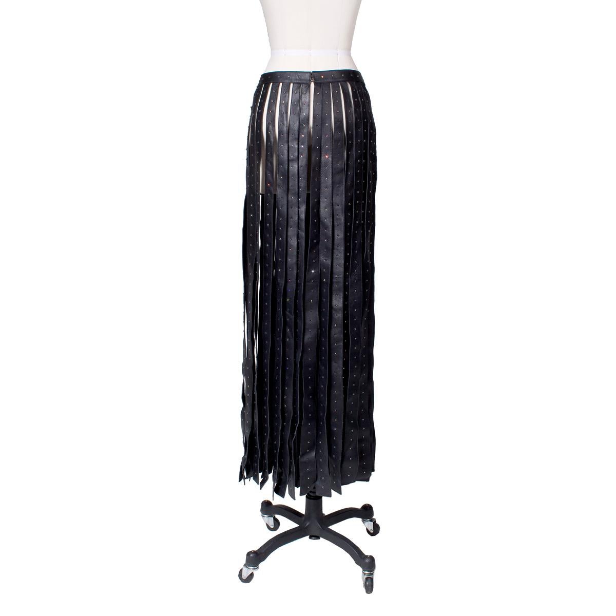 Product Details:
Skirt from Valentino circa 2016
Long fringe strips of black leather with rhinestones
Hook closure on waistband
Condition: Excellent

Size/Measurements:
Labelled size 10 US
34