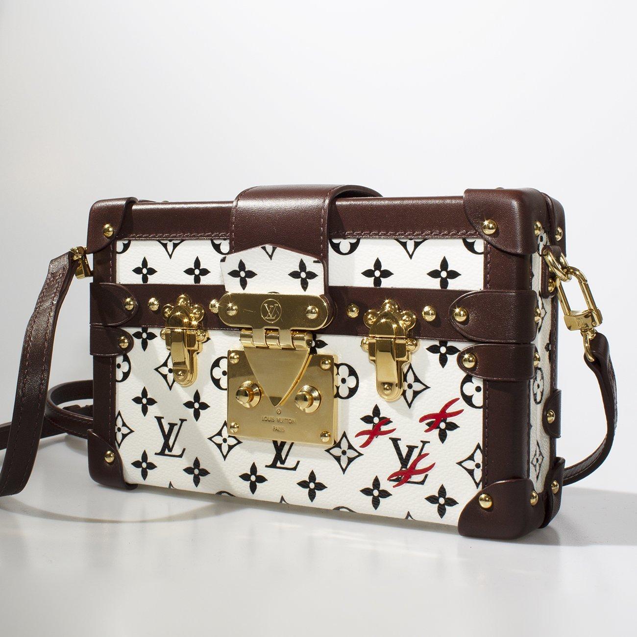 Louis Vuitton Black and White Monogram Petite Malle 
Spring/Summer 2016
White toile canvas with black monogram 
Dark brown leather trim
Decorative brass buckles and press lock
Magnetic opening halves
Length: 7.5