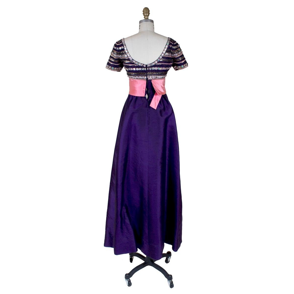Gown by Pierre Balmain
Empire waist
Striped beaded bodice
Pink satin waistband
Purple silk linen skirt
Condition:  Good vintage condition.  Beading is delicate and missing some in places, and the seams around the zipper are ripping, but the original