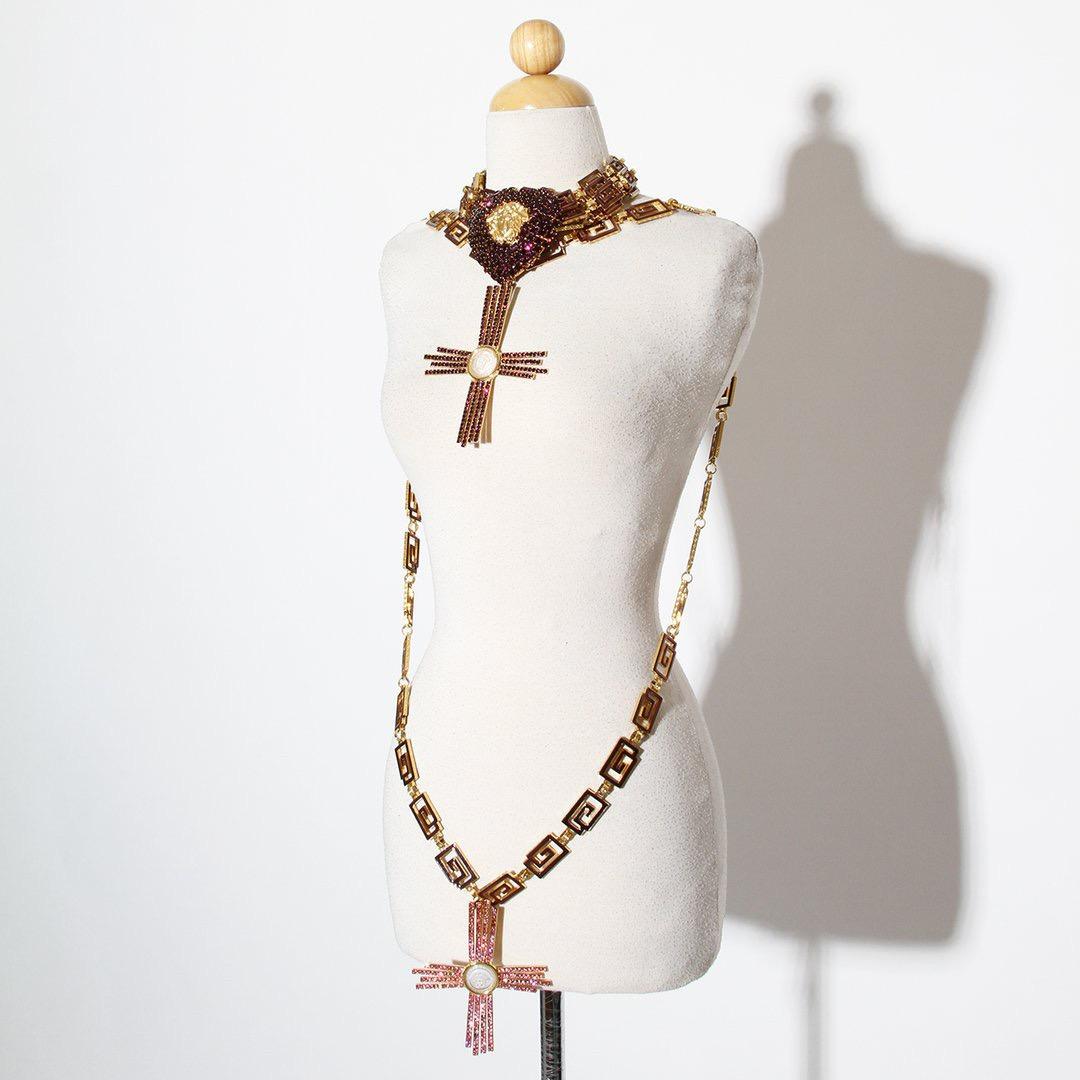 A unique lifetime Gianni Versace crystal heart and cross necklace with low slinging belt. This work of art is most likely a creation derived from the namesake designer's Atelier (Haute Couture) collections of the early 1990s.  The enameled Greek key