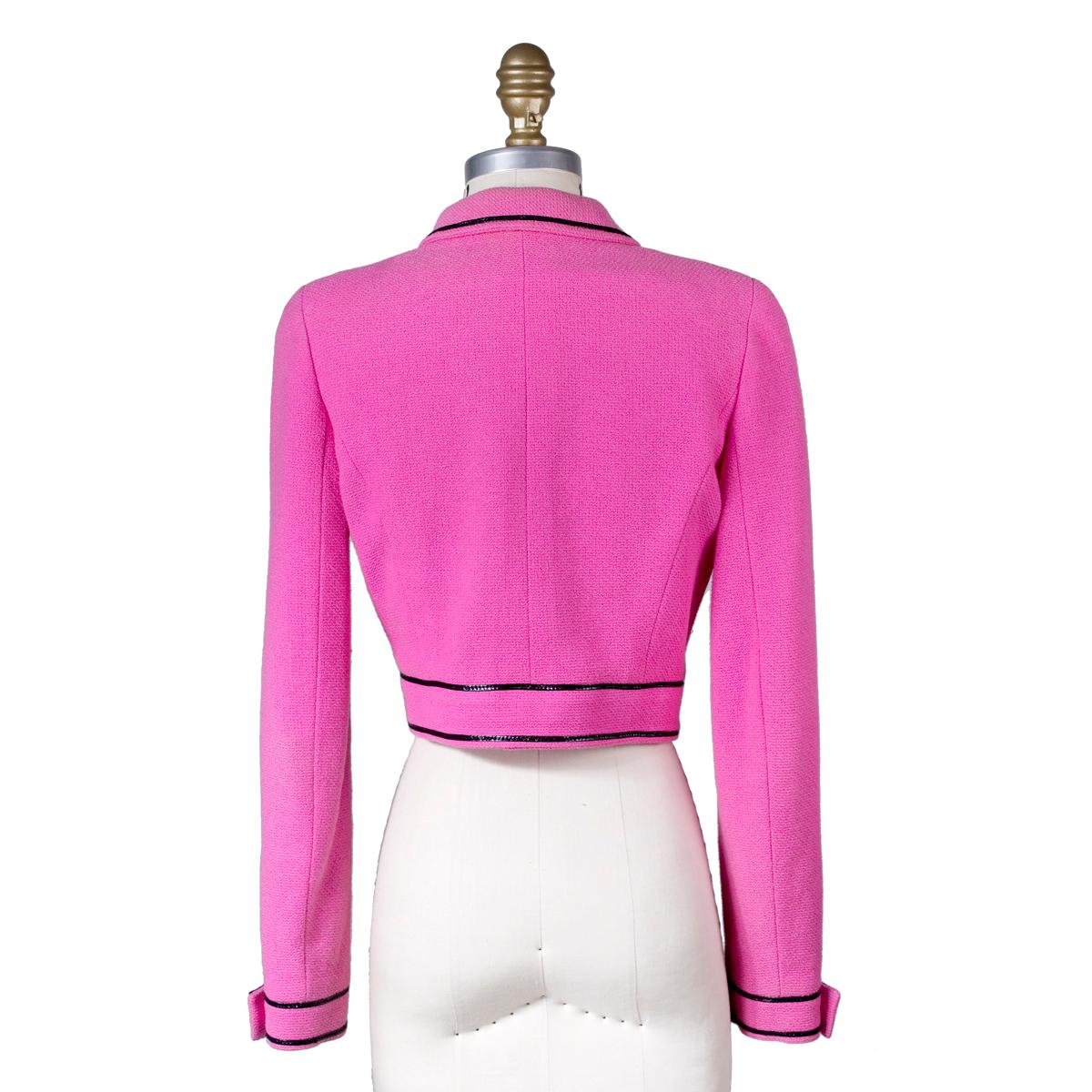 Vintage jacket from Chanel for S/S 1995-1996
Cropped bolero style fit
Hot pink wool with black patent piping details
Silk satin lining and gold chain detail inside along bottom hem
Condition: Excellent
Size/Measurements:
Size 34 approximately 
15
