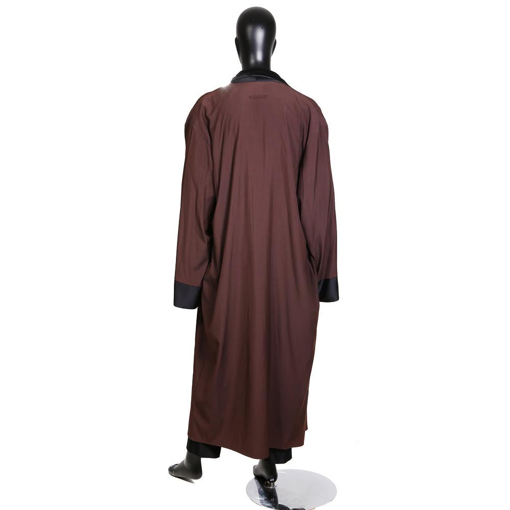 Men's long robe by Jean Paul Gaultier circa 1990s
Brown with black silk satin lapel and trim on cuffs 
Multicolor graphic print lining
Condition: Excellent

Size/Measurements:
Size 40 (US)
59.5