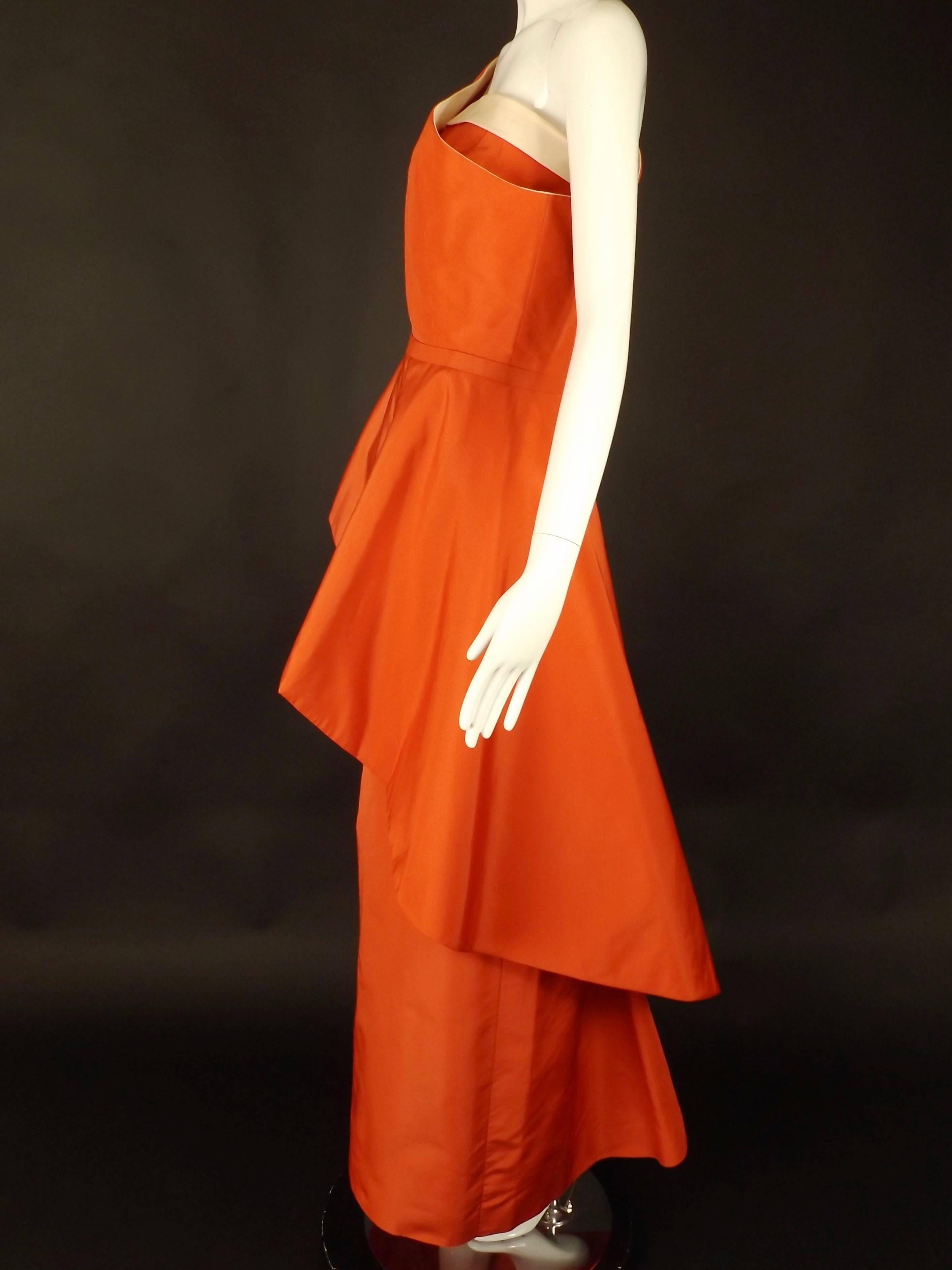 This is a stunning evening gown from the late 1950s/early 1960s in a dark salmon, almost red silk twill by the Fontana sisters. I have not been able to find any reference to this gown online or in any books. How exciting! The gown has a dart fitted,