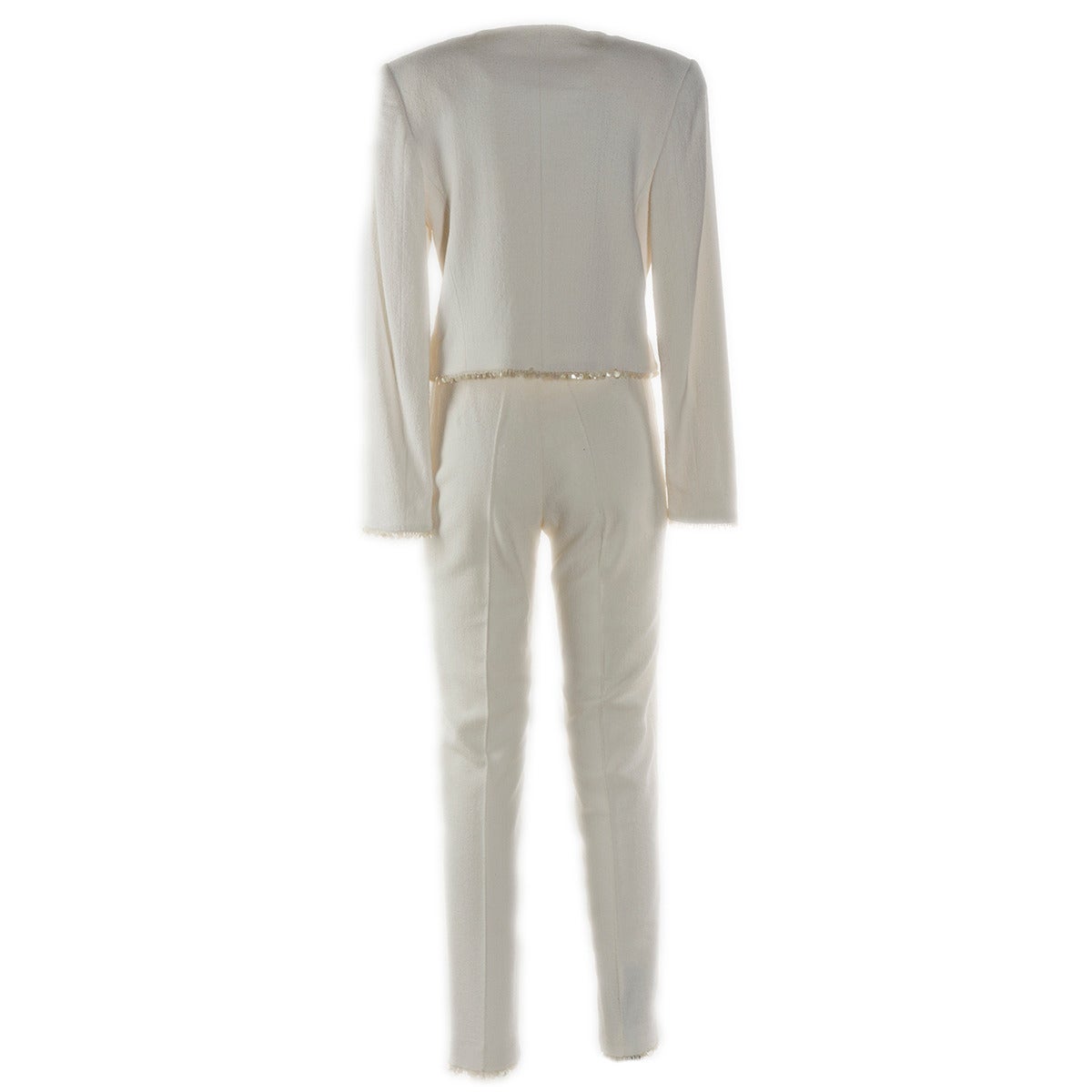 Wonderful and very elegant Escada by Margaretha Ley pant suit
White color
Embroidered with white paillettes
One single transparent button on top
Rayon
Size 6 U.S.
Made in Germany
Worldwide express shipping included in the price !
