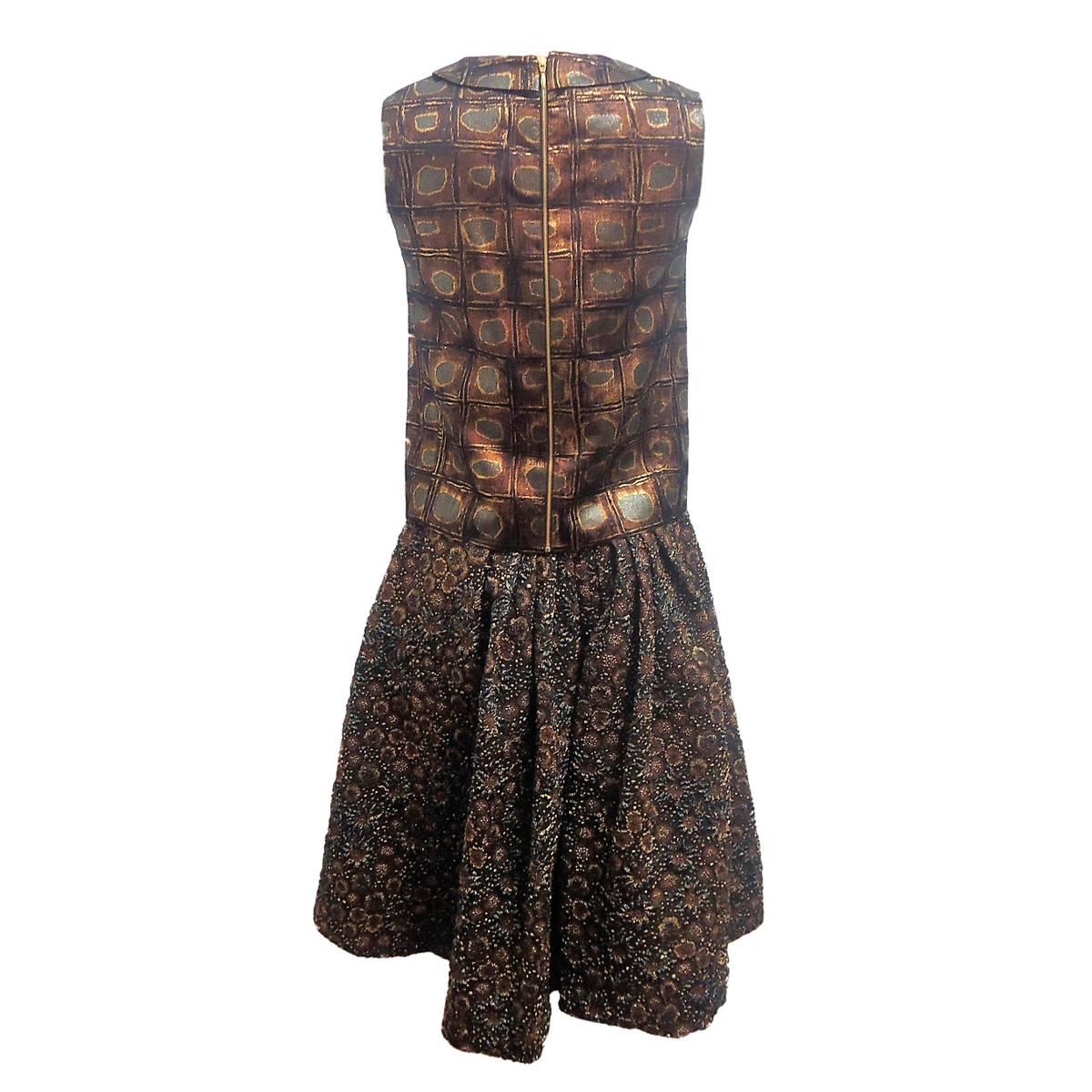 Magnificent skirt and top suit by Rochas, France
Embossed textile
Bronze tones
Fantastic embroidered skirt
Geometric top
Size italian 40 (US 4/6)
Made in Italy
Worldwide express shipping included in the price !