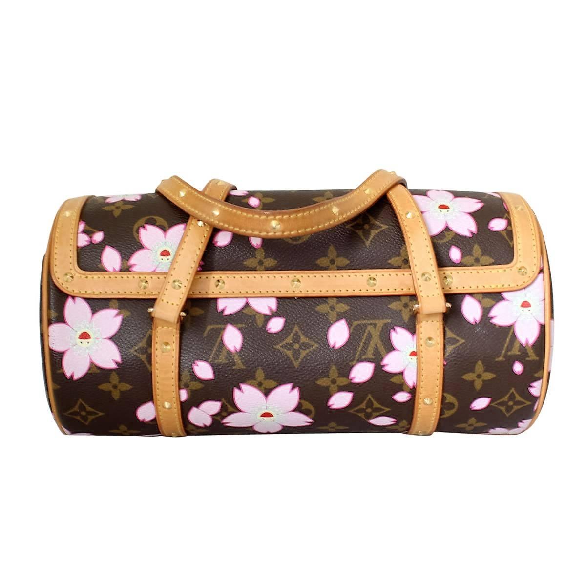 Amazing Louis Vuitton bag, 2003 Limited Edition
Monogram Cherry Blossom Papillon
Leather handles and inserts with golden studs
Monogram with pink flowers and happy expressions
Designed by Takashi Murakami
With locker and keys
Buttons