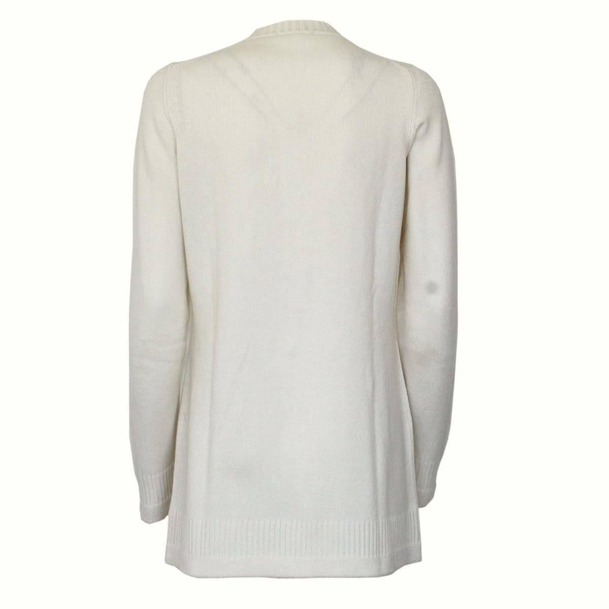 Iconic Chanel cashmere cardigan
100% cashmere
Cream color
Button closure with Chanel logo
Long sleeve
4 pockets
Lenght from shoulder cm 68 (26.7 inches)
Internal Chanel tag removed by previous owner
Worldwide express shipping included in the price