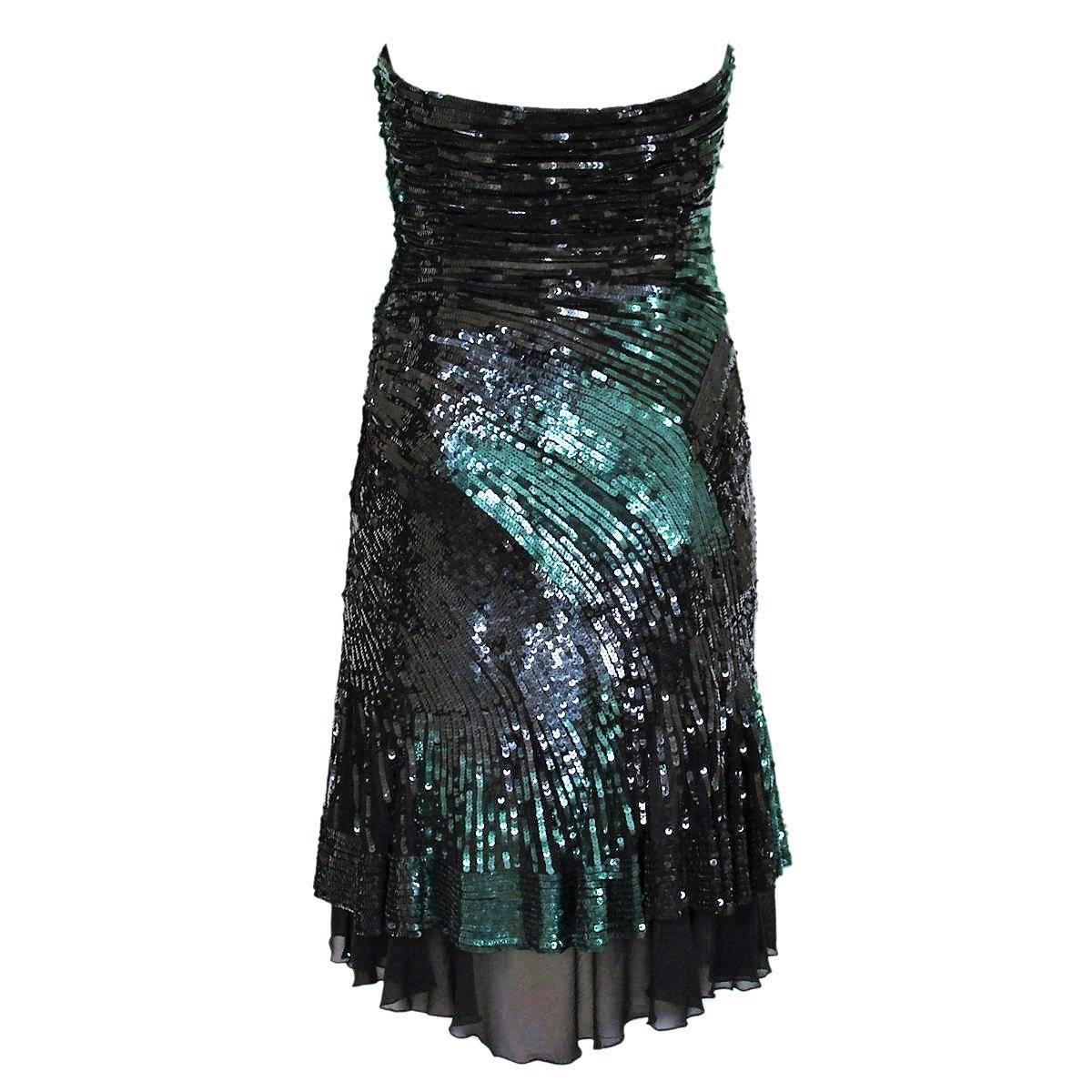 Magnificent Versace cocktail dress
Originally priced € 5000 (5900 US$)
Haute couture
Mixed fabric 
Black and green color
Finely worked sequins inserts
Lateral zip closure
Total lenght cm 74 (29.1 inches)
Made in Italy
Worldwide express shipping