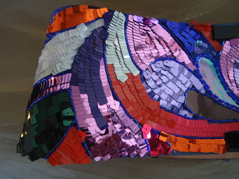 Wonderful, stunning, amazing, rare ... no words for describing this large belt by Giorgio Armani.

Totally made by sequins, colored in blue, light blue, red, orange, fuchsia, green, purple and black.

The belt is 4,9 inches large and it is made