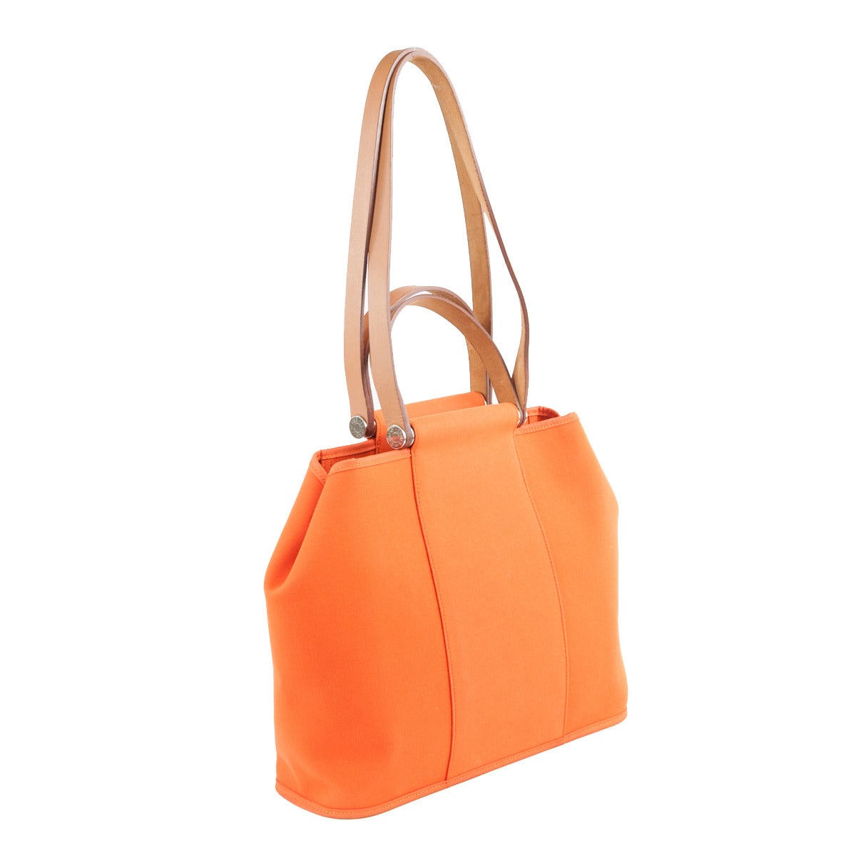 Beautiful and particular Hermès handbag
Classic orange Hermès textile color
Leather handles
Can be carried by hand or as shoulder bag
Particular hexagonal shape
Two inside pockets, one with zip
Cm 32 x 27 x 11 (12.5 x 10.6 x 4.3 inches)
Minor
