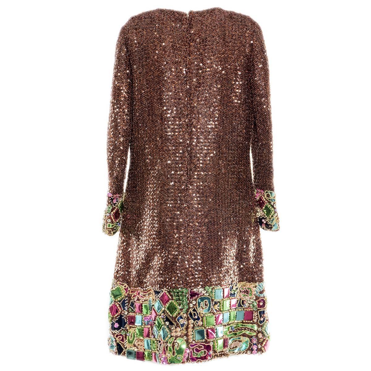 Fantastic cocktail dress made by italian tailoring
Teresa Bernardelli, Bologna
Completely covered by brown sequins
Multicolored inserts at the end of the dress
Medium size (US 8/10)
Made in Italy
Worldwide express shipping included in the