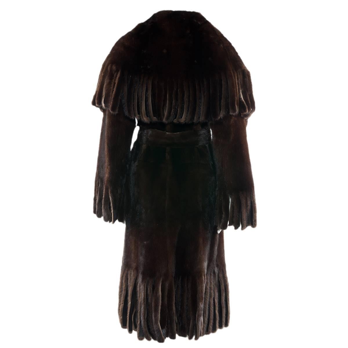 Magnificent Dolce & Gabbana fur coat
Ultra rare (only 4 exemplary sold in the entire world)
100% Brown mink fur
100% Brown leather inside
Fantastic cut with frings(carved, not added) 
Large back shawl
7 Authomatic buttons
Size italian 42 (US