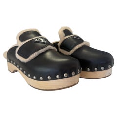 Mules Prada in pelle marrone e montone IT 38