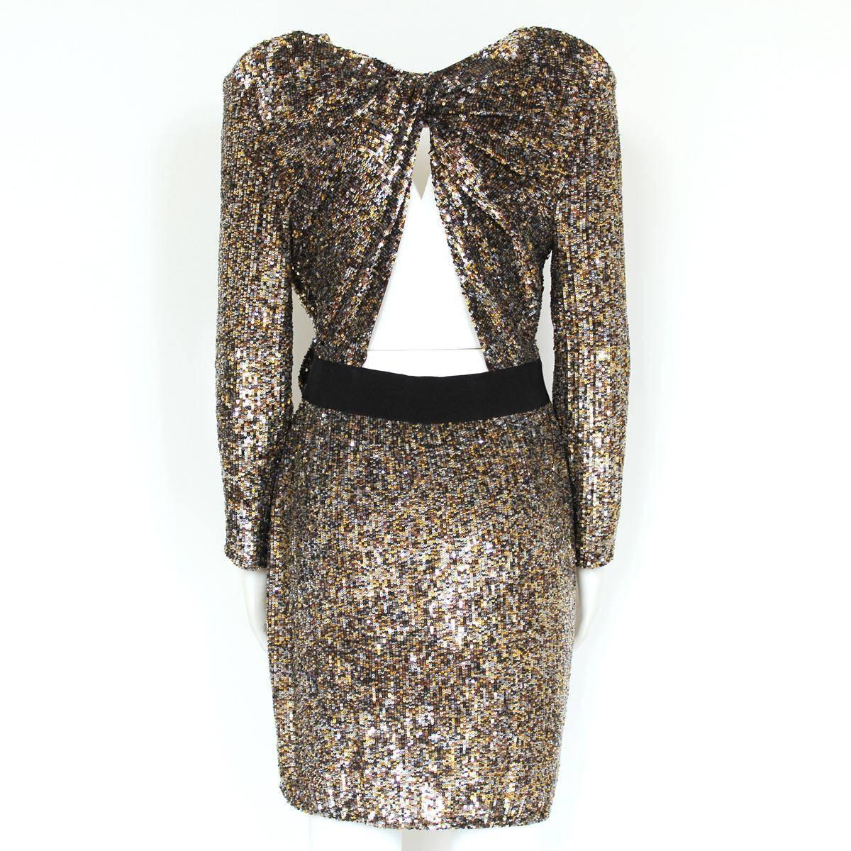 Fantastic and ultra chic Phillip Lim sequins dress
Seen also on Petra Ecclestone
Cocktail dress
Multicolored sequins
Bronze / gold effect
Central bow
Black belt
Long sleeve
Open on back
Total lenght (shoulder/hem) cm 90 (35.4 inches)
Size 4 (Italian