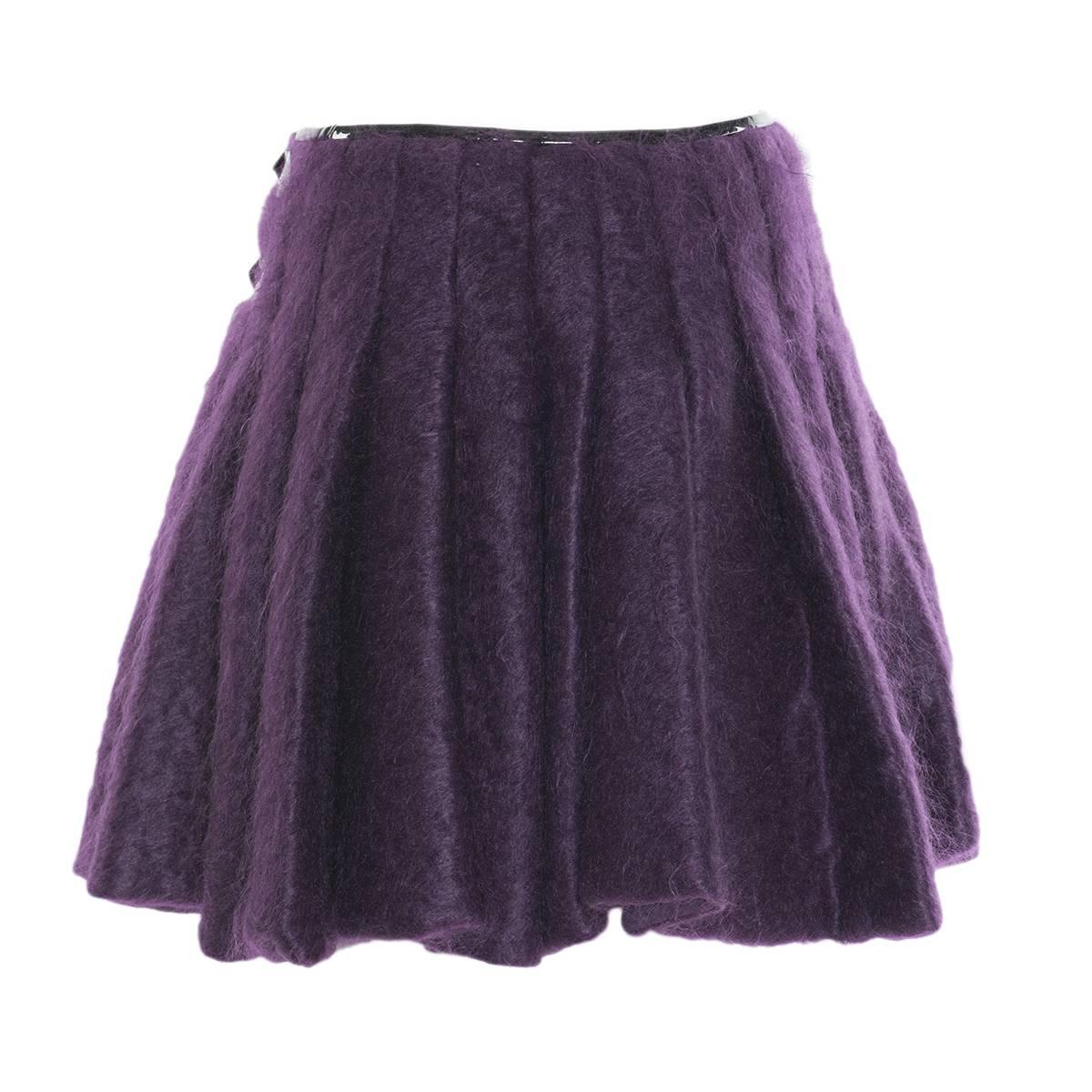 Beautiful skirt by Jean Paul Gaultier Femme
Mohair wool
Silk lining
Purple color
Black patent leather profile and belts
Made in Italy
Worldwide express shipping included in the price !