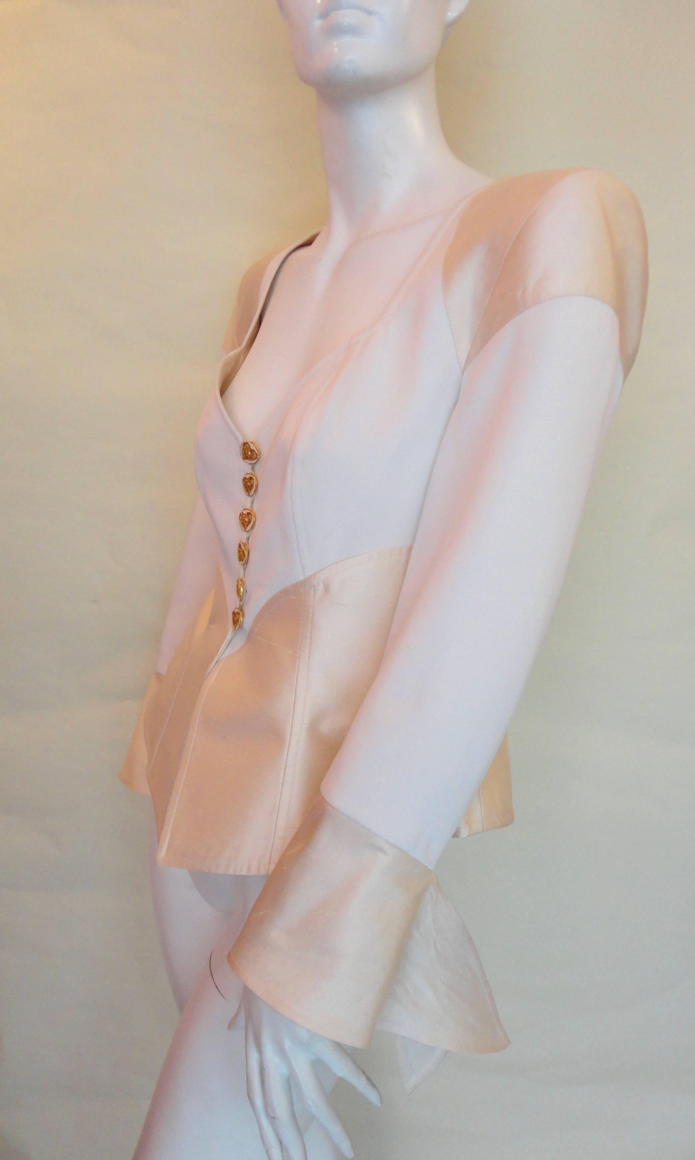 Christian Lacroix white and beije silk jacket, with heart shape neckline. Beautiful flower detail buttons.
Very good condition, not showing any signs of wear. 
Shoulder 43 cms
Sleeve 56 cms