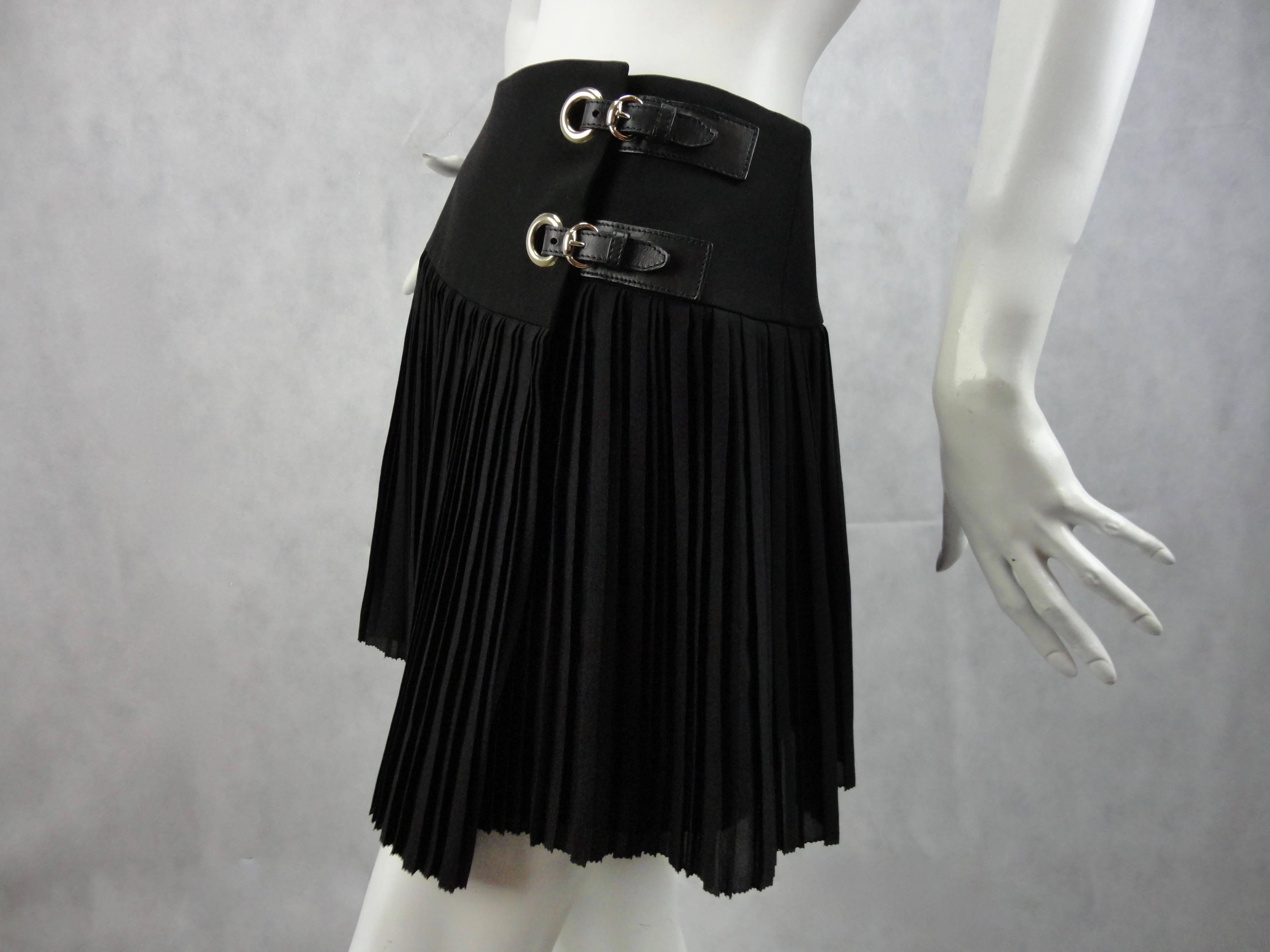 Black Gucci pleated skirt with leather buckle details.
Mint condition.