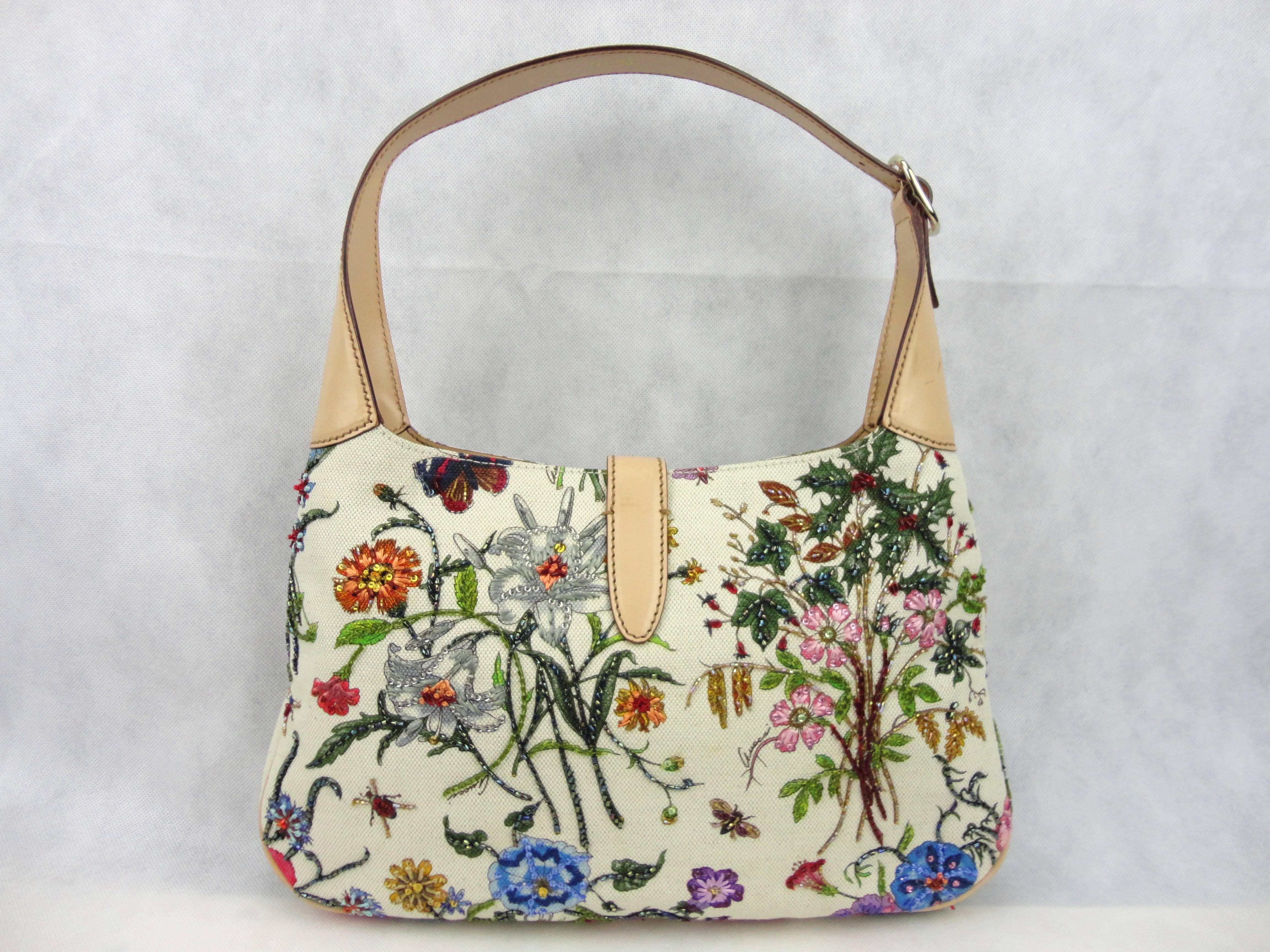Gucci canvas floral Flora Jackie O hobo bag from Gucci 2005 cruise collection. Extremely hard to find, this hand embroidered limited edition bag is one of Gucci´s icons. This bag is beautiful crafted of brightly colored floral canvas with beads all