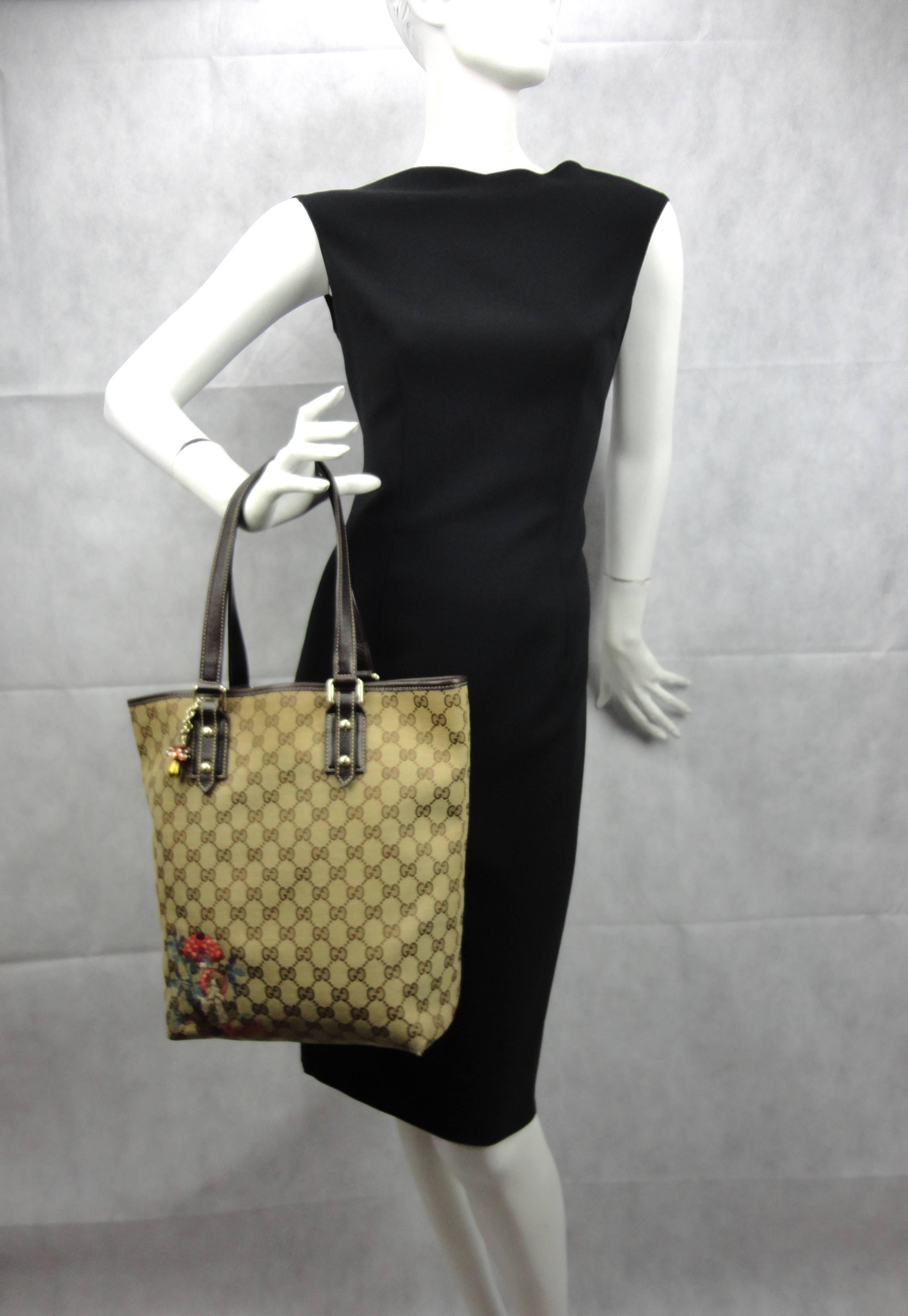 From the mushroom collection by Gucci, this Gucci tote is too adorable. The beje monogram exterior has a mushroom embroidery and a gold tone mushroom charme with a Gucci plaque. 
Used a few times, very good condition overall, just showing some light